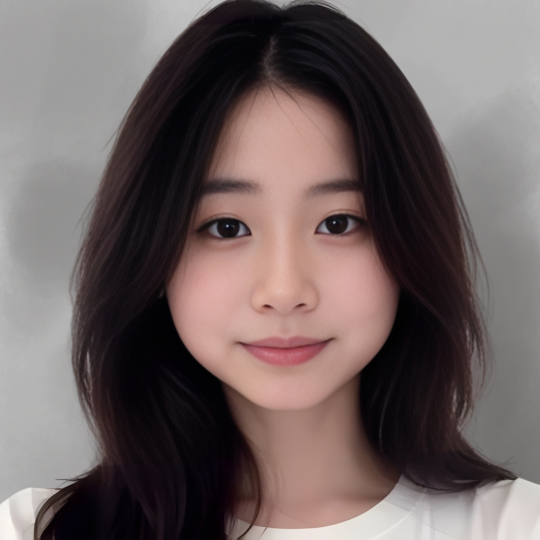 Close-up portrait of a young woman with long dark hair and light skin, smiling softly, wearing a white top, against a neutral background.