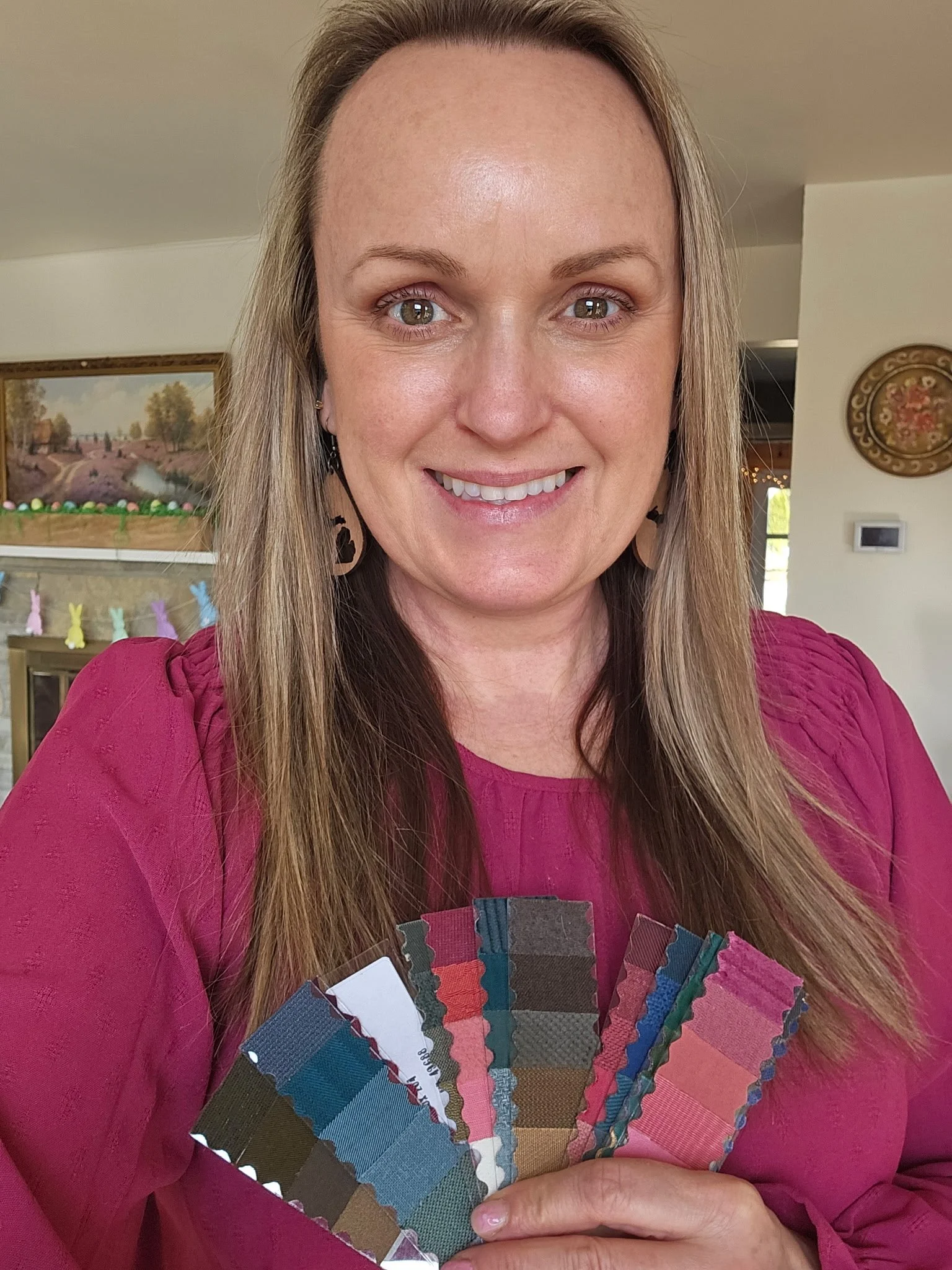 Client of color analyst Laura Longmire holds her color swatch fan