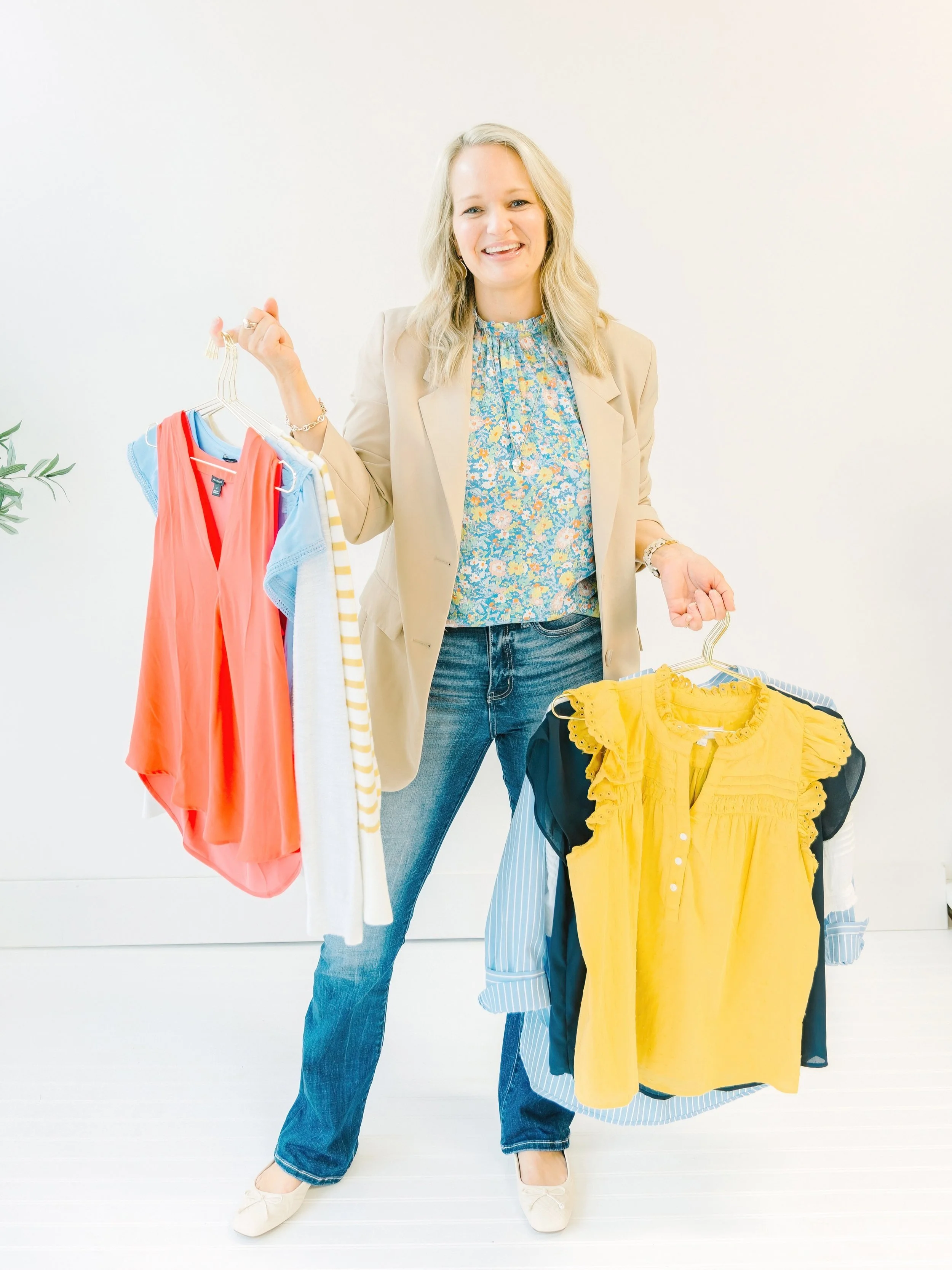 Personal wardrobe stylist Laura Longmire of south Texas holds clothes for a shopping client