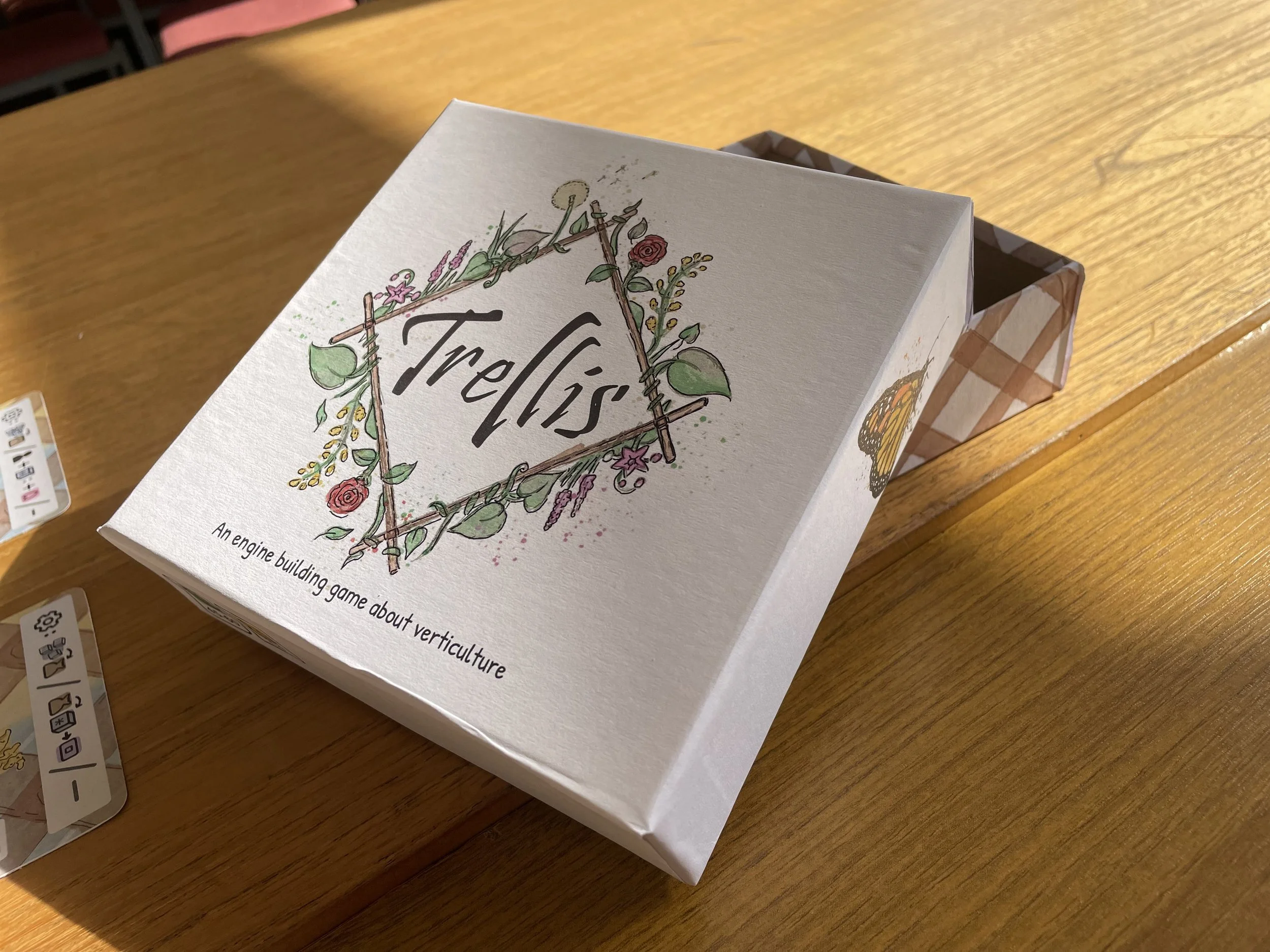 A board game with a planet themed logo for Trellis