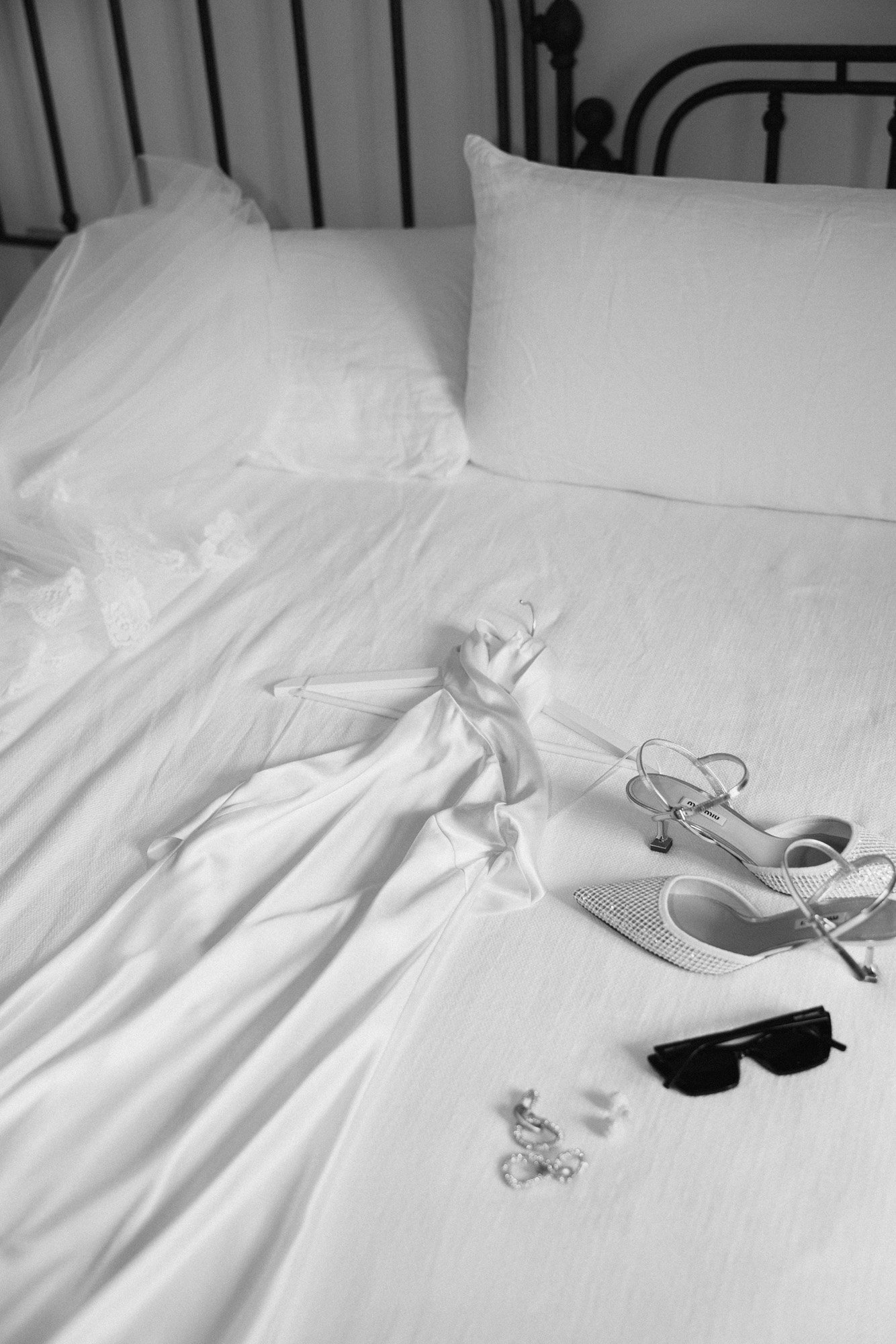  miu miu bridal heels styled with the brides gown and pearl stud earrings by abellie in the bridal suite in italy. 