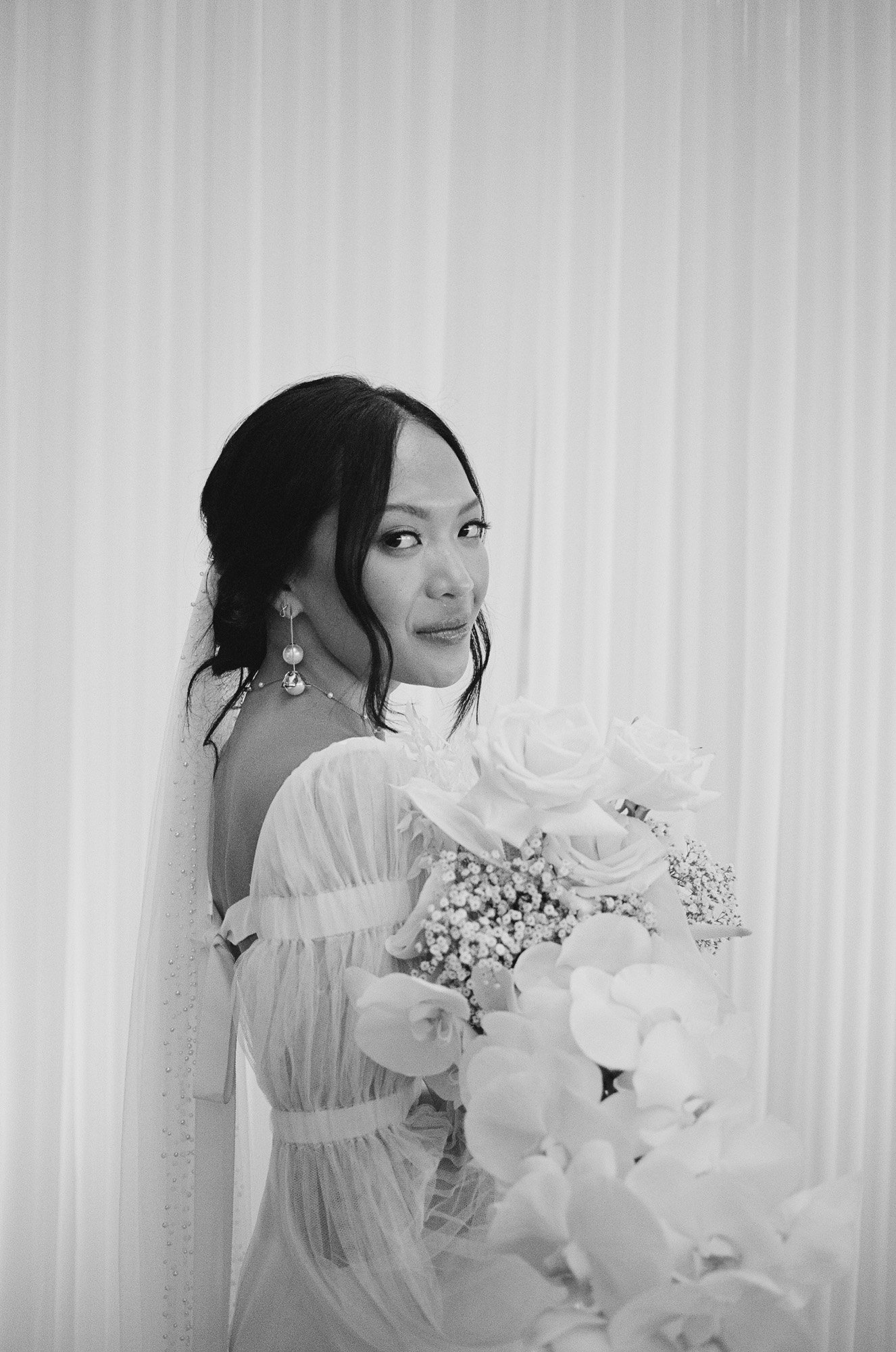 danielle-frankel-wedding-gown-with-bardot-pearl-earrings-by-abellie-dawn-and-michael-realwedding-02.jpg
