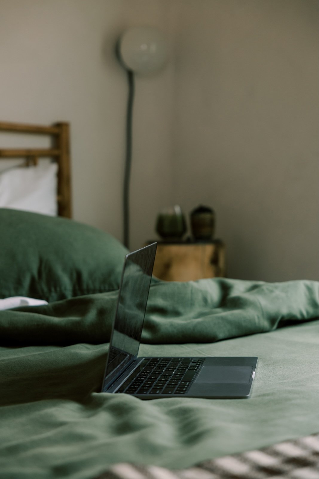 A laptop on a bedrepresenting the brand strategy process before website design