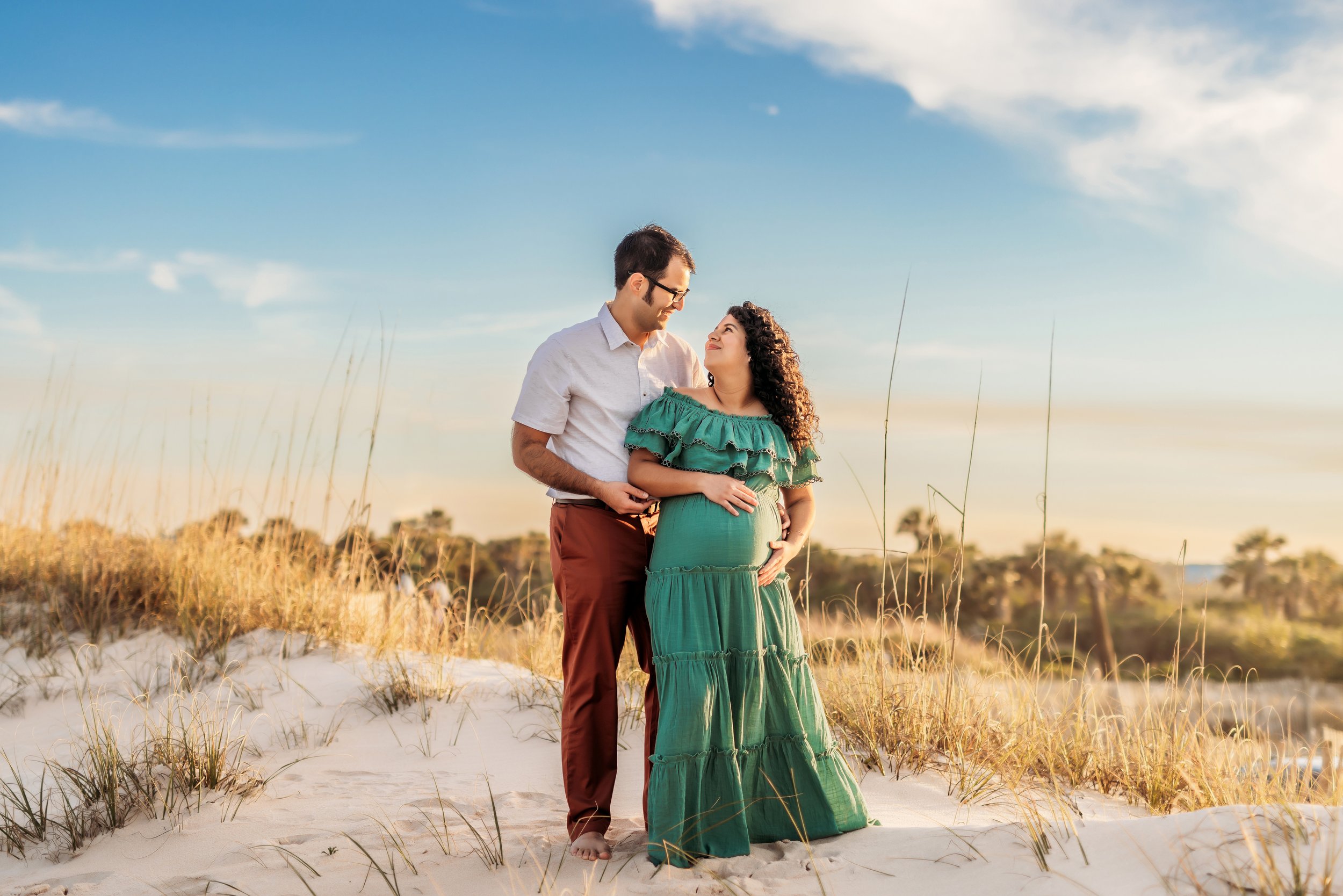 Couple maternity session under oak trees with Spanish moss at Washington Oaks State Park Florida