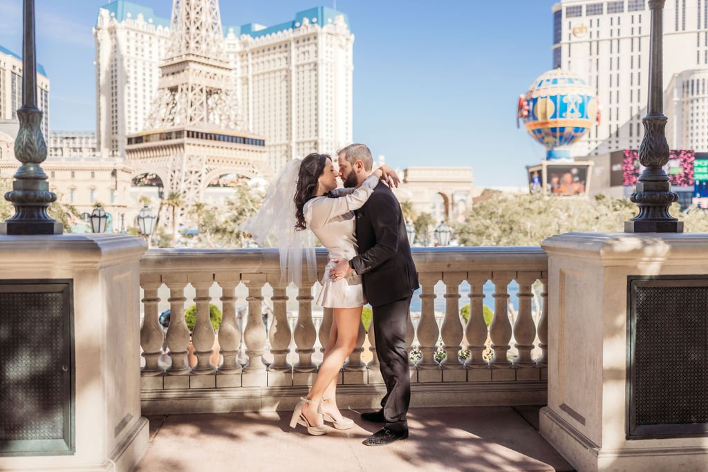 Stephanie and Gary embrace in front of the Bellagio fountains in Las Vegas