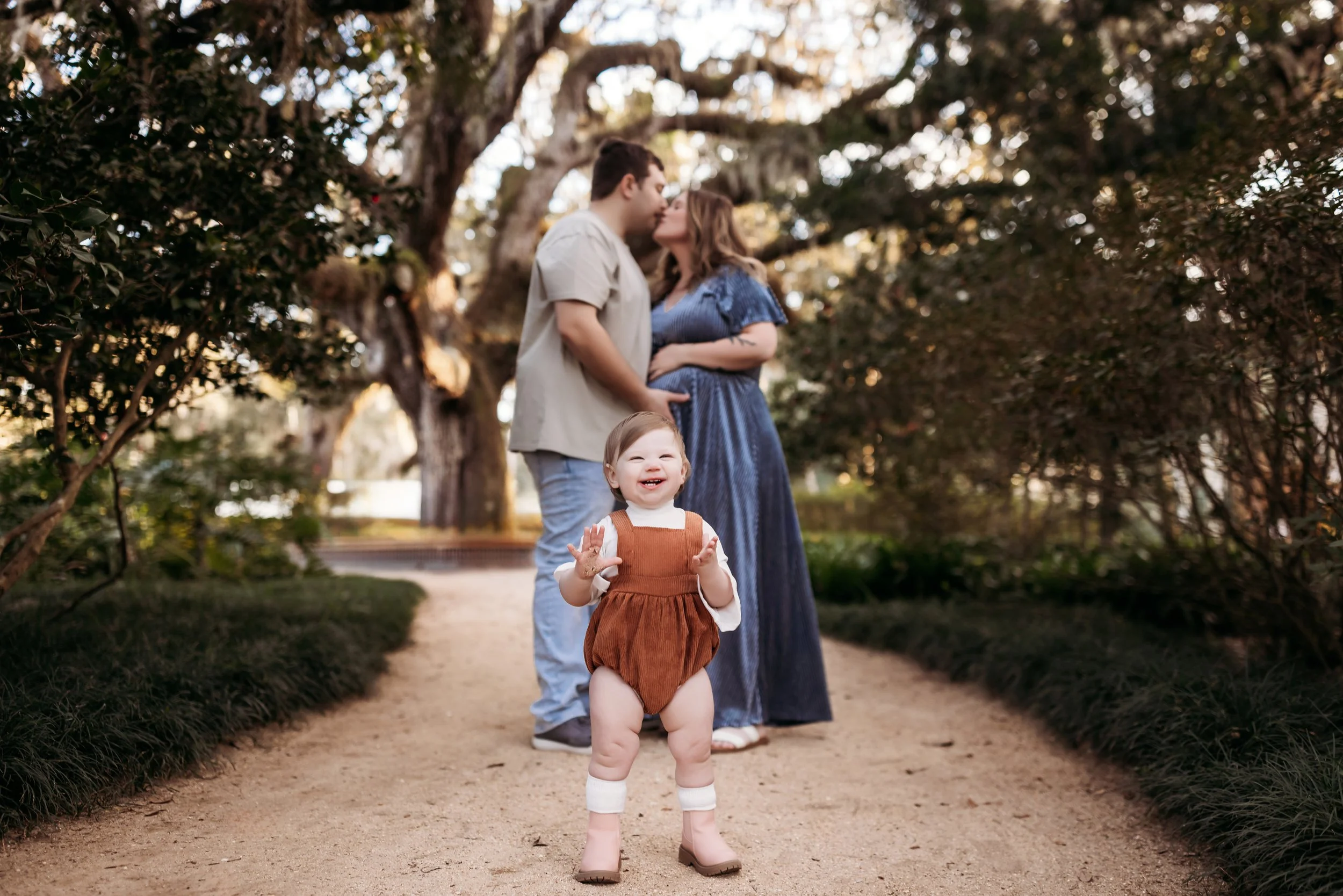 Maternity photos at Washington Oaks State Park in Palm Coast Florida with oak trees and Spanish moss