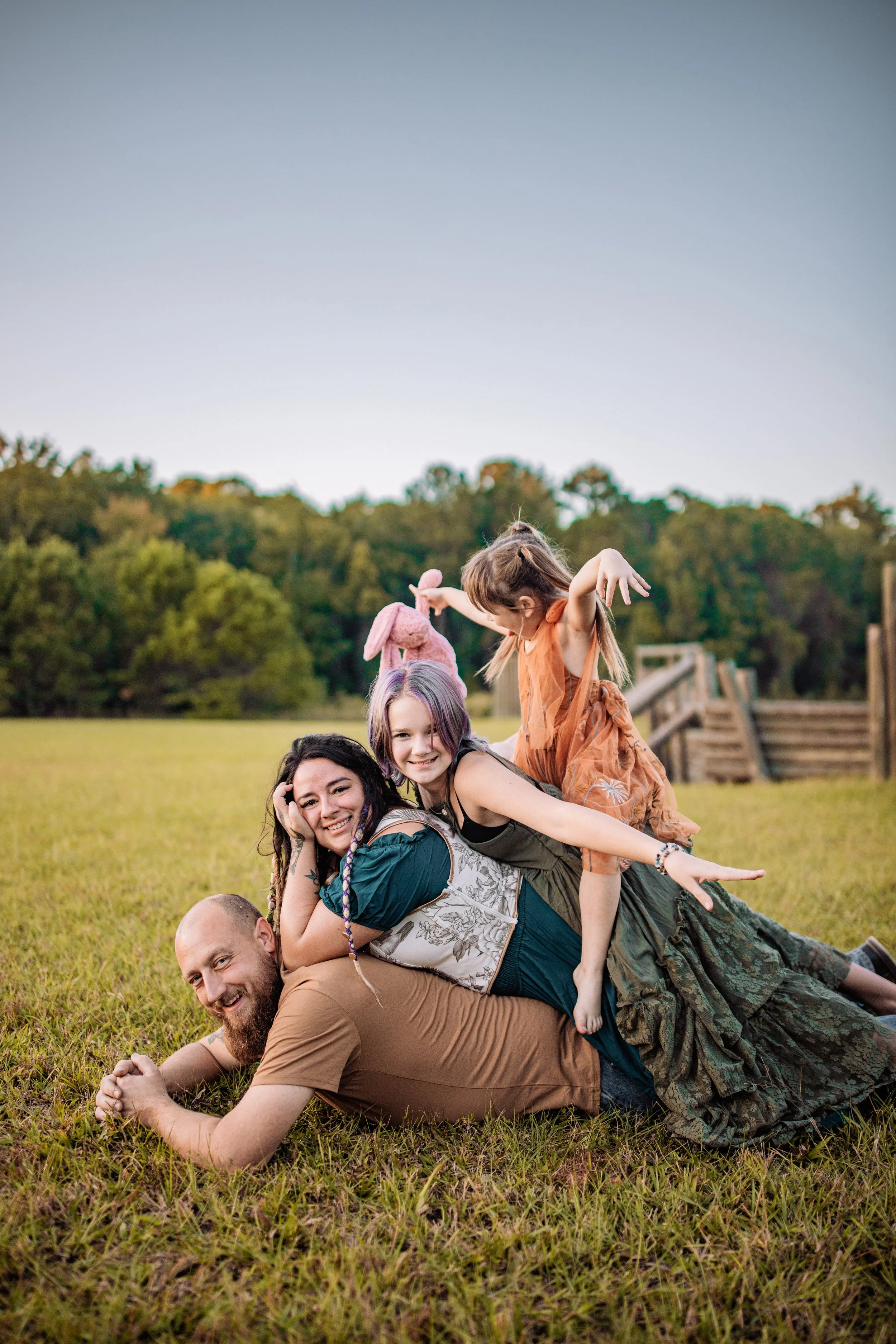 Kids laughing and playing together during candid family session at Camp Milton in West Jacksonville Florida
