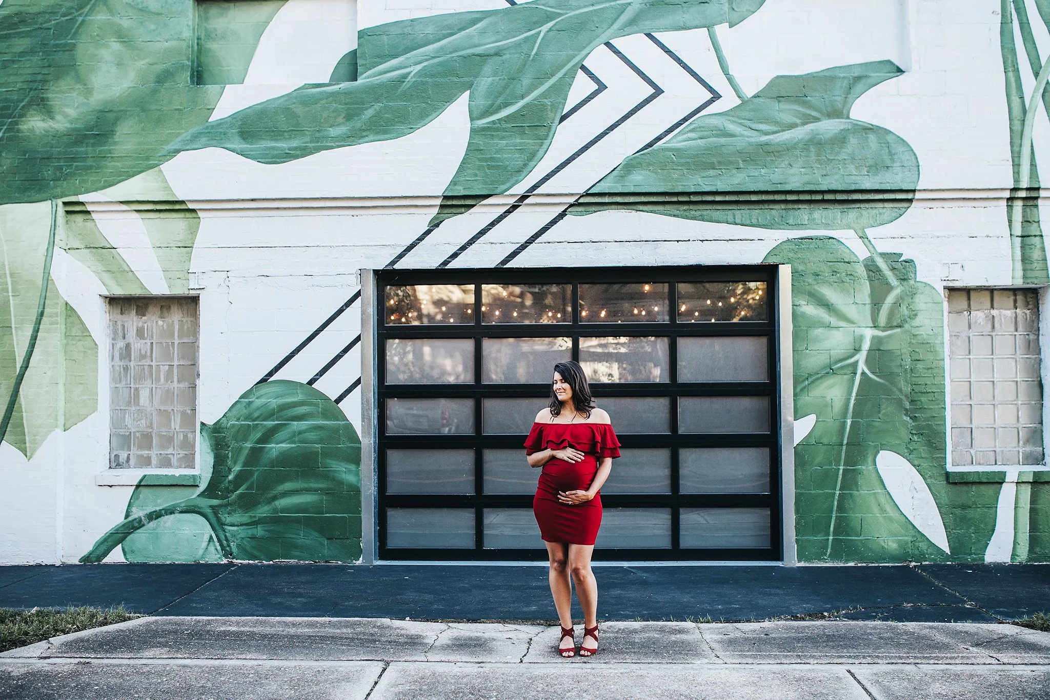 Maternity photos in downtown Jacksonville Florida with artistic mural background and bold styling