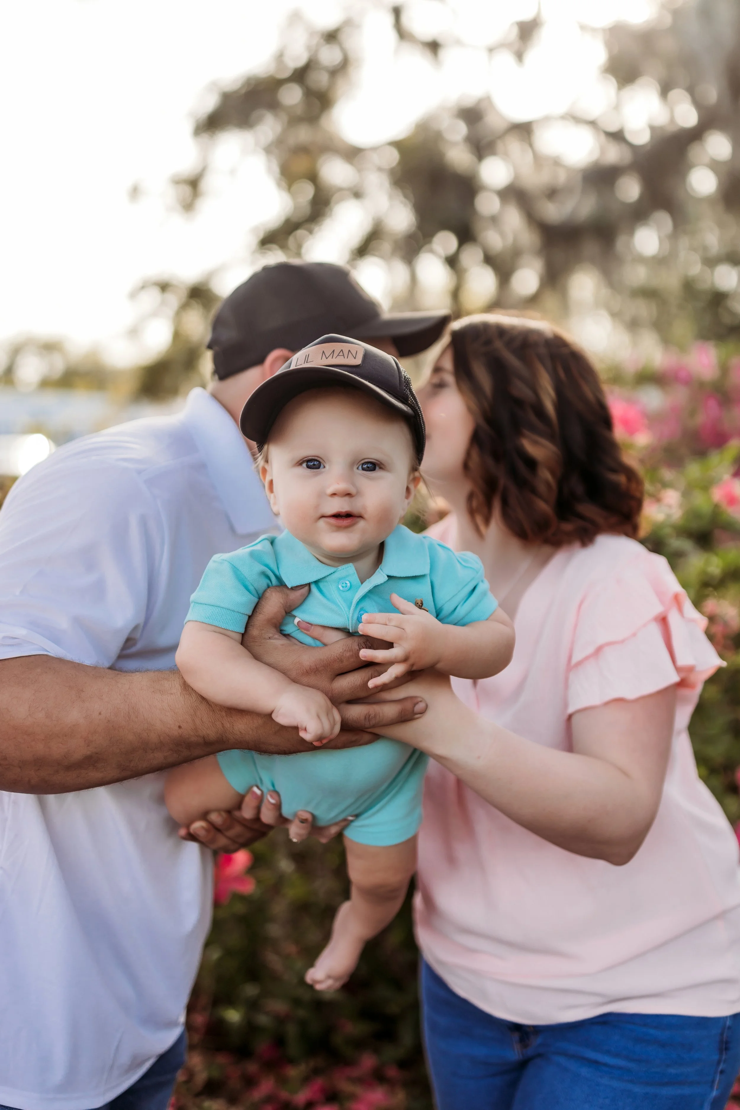 Playful couple posing under oak trees with spanish moss in Riverside Jacksonville Florida