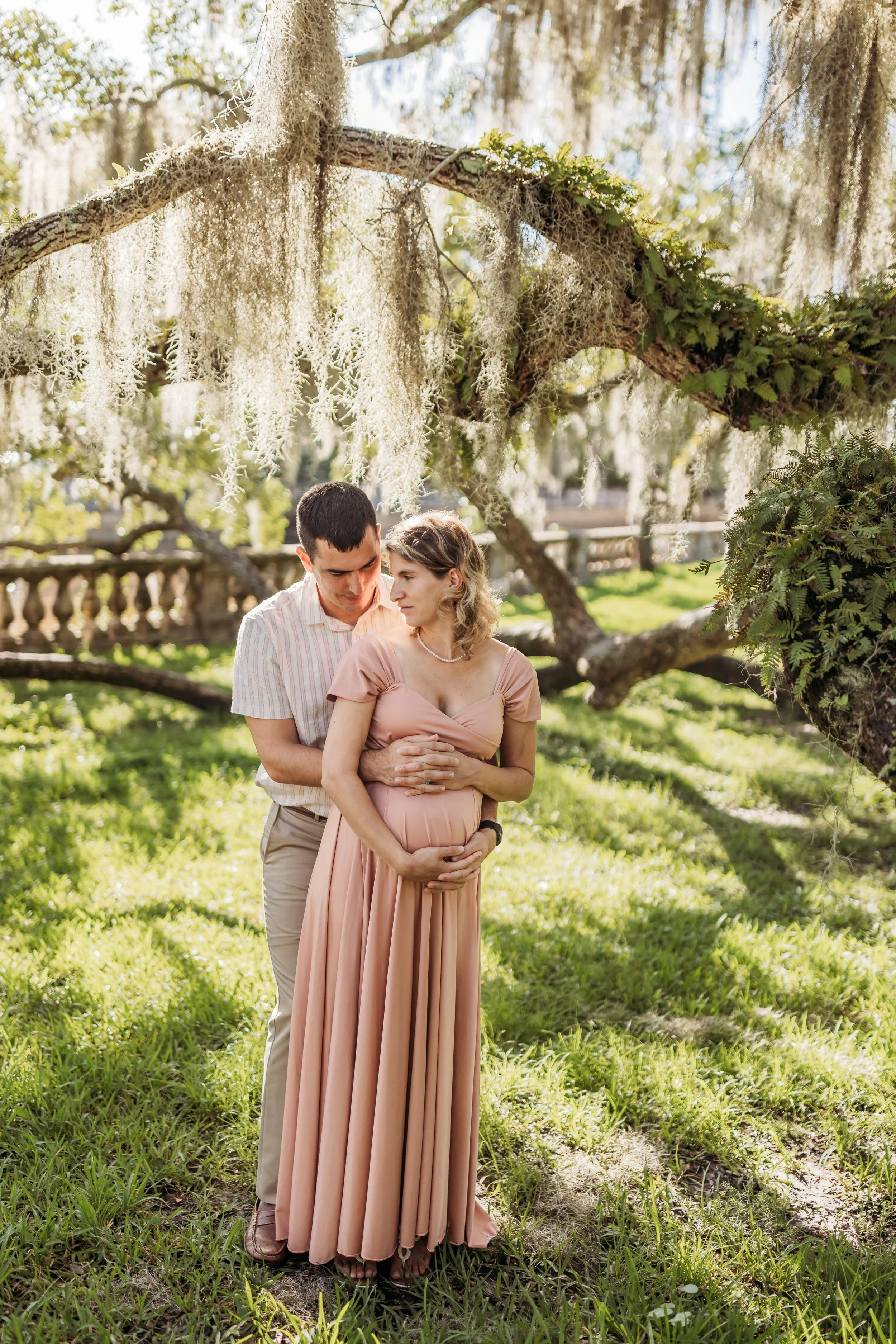 Pregnancy photos in Riverside Jacksonville Florida with oak trees and soft golden light