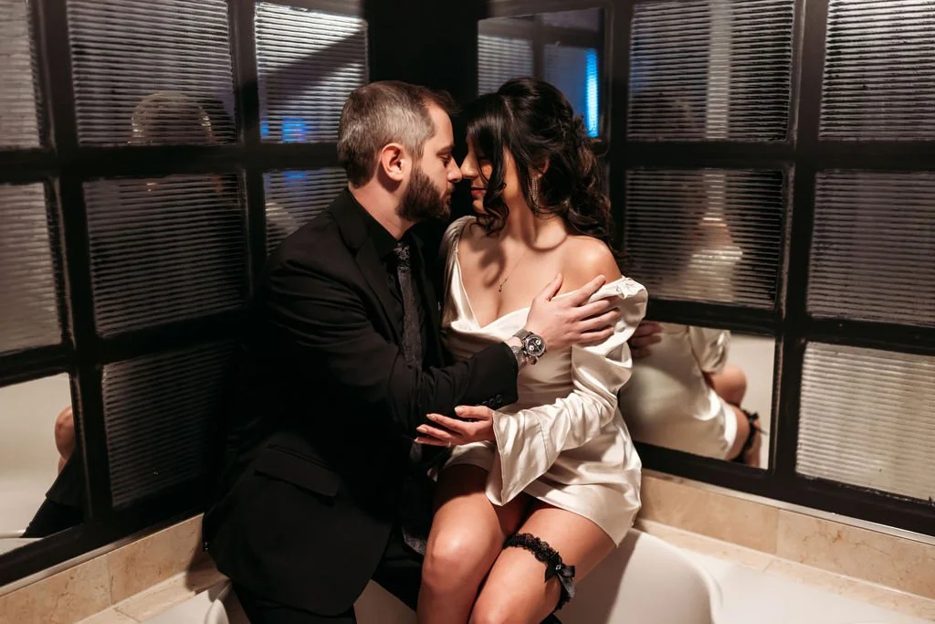 Stephanie and Gary kiss while getting ready together in their Las Vegas hotel room