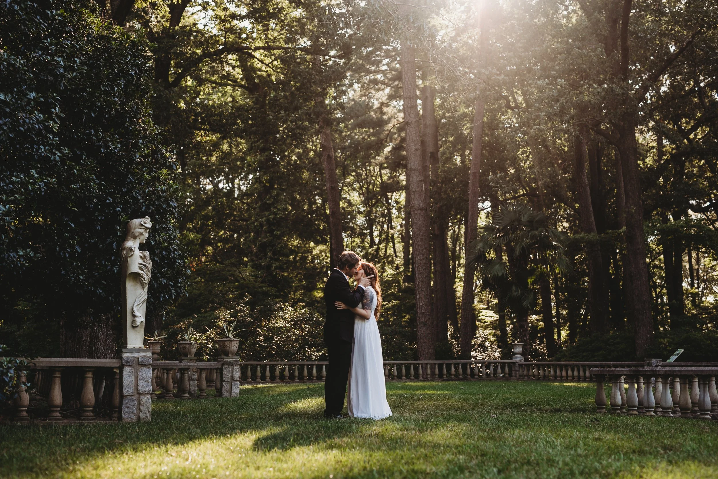 Intimate elopement in a romantic garden setting in Jacksonville, Florida with couple embracing under soft sunlight