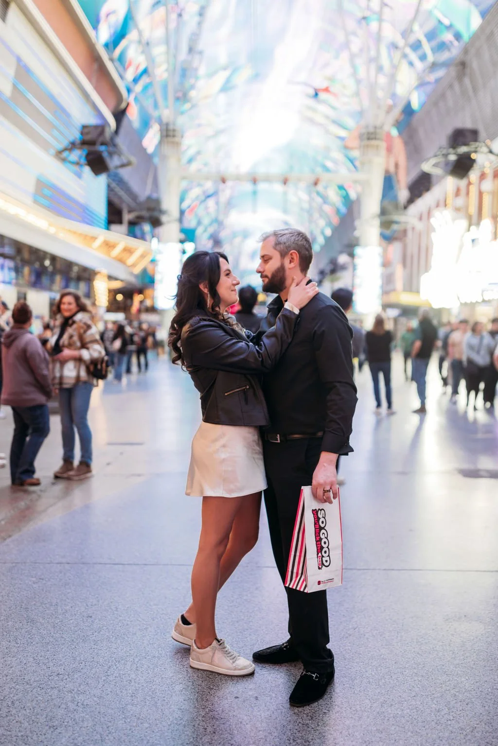 Stephanie and Gary celebrate their elopement beneath Fremont Street casino lights