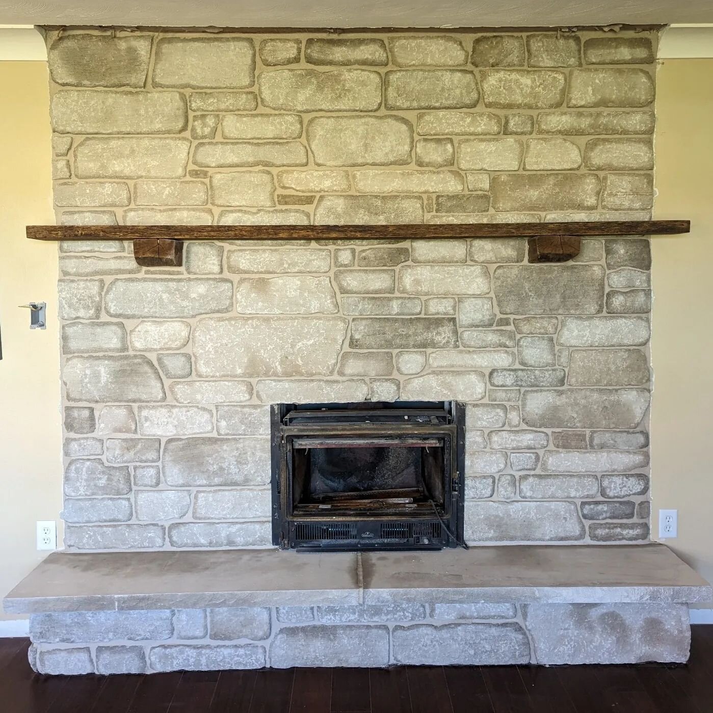 The stone we installed on this fireplace 🔥 is limestone and we used white mortar to contrast the lightness of the stone. We also custom cut a piece of limestone to use for the hearth.
