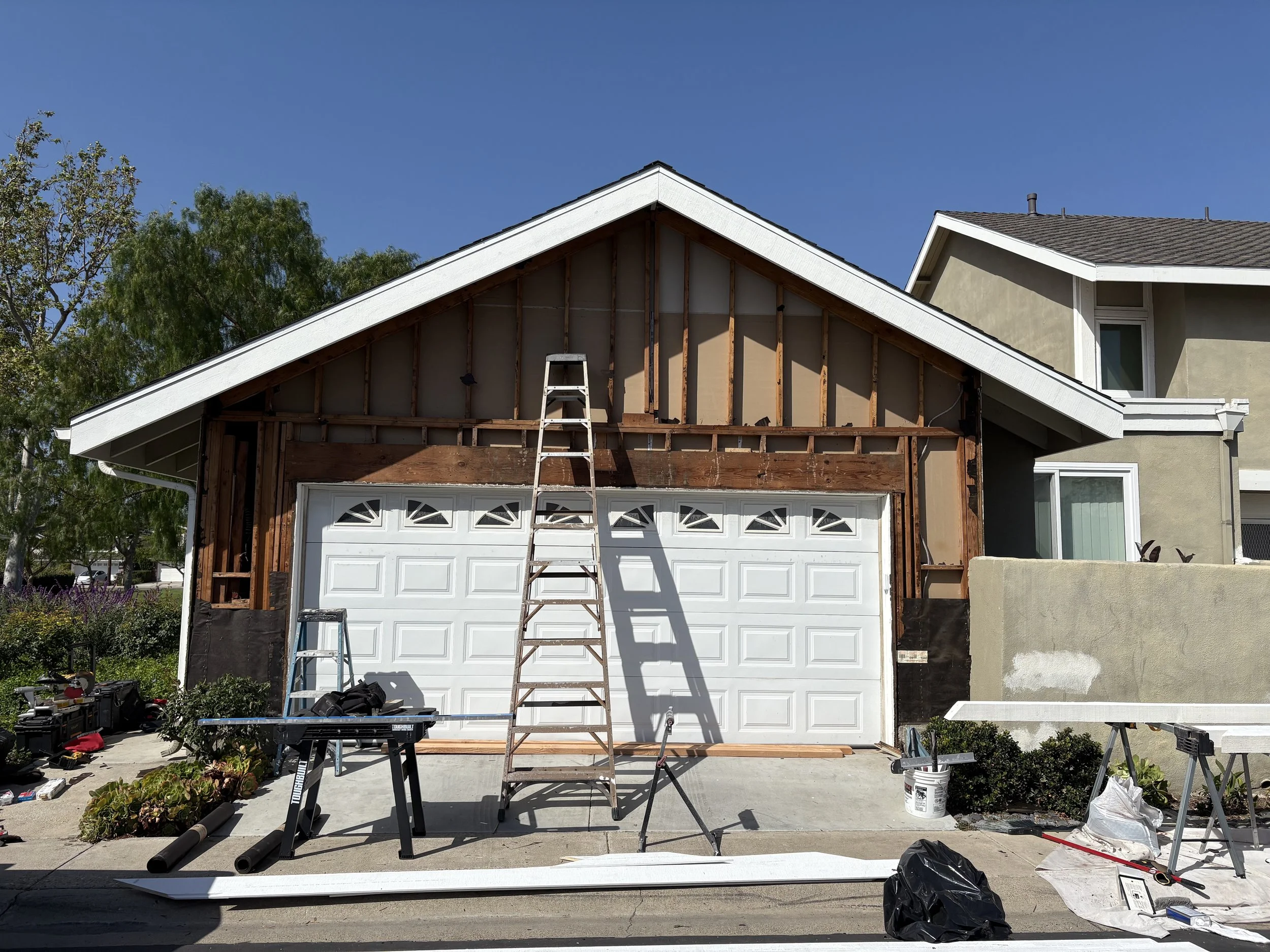Shiplap was removed to reveal disintegrating paper. Paper was replaced for water protection.