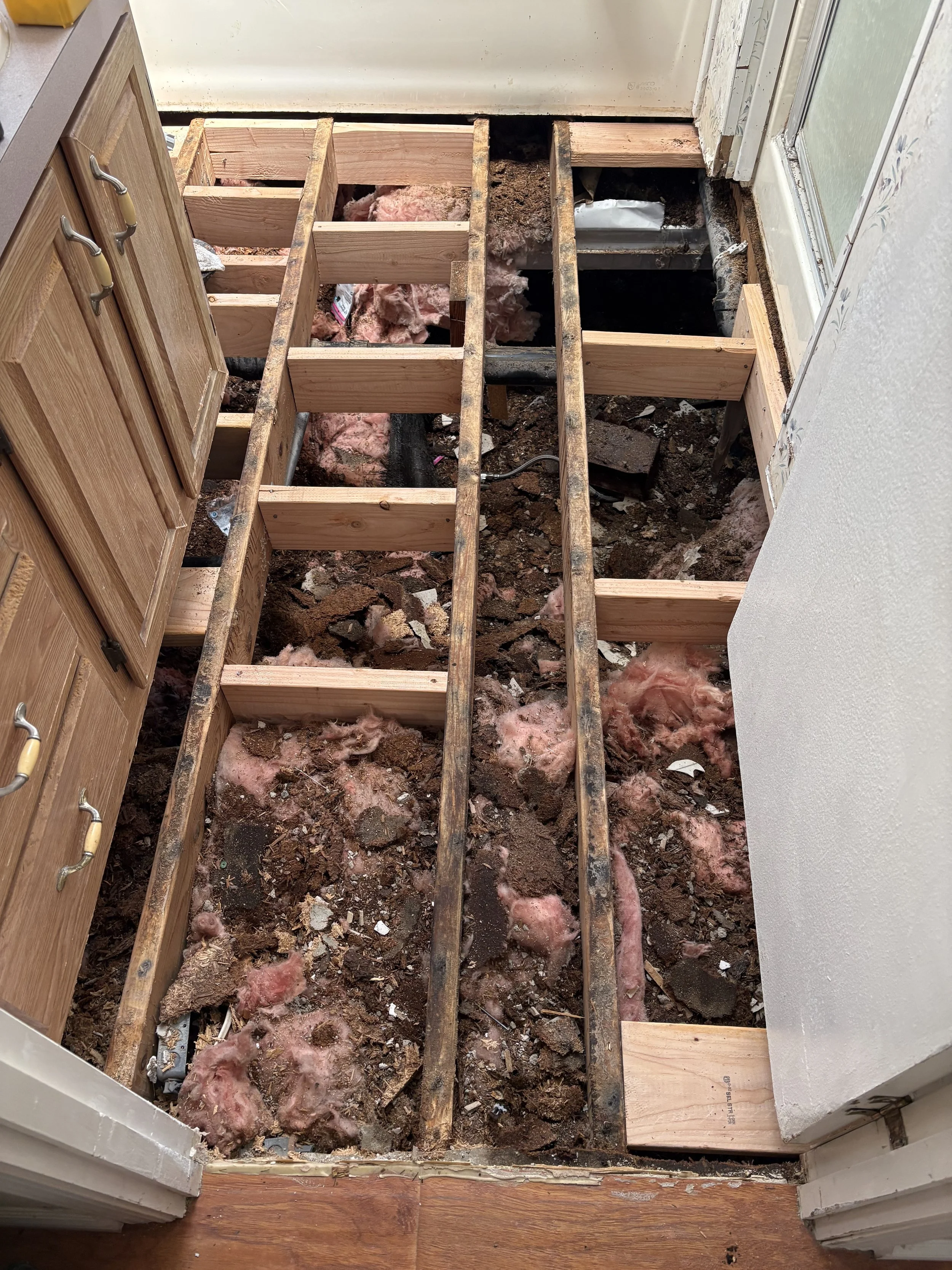 Tile and subfloor removal and addition of blocking for new subfloor