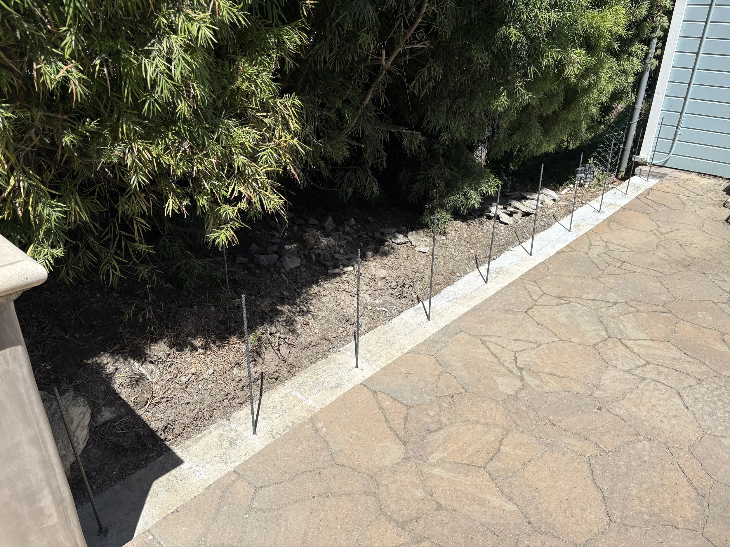 Flagstones removed, rebar drilled into slab