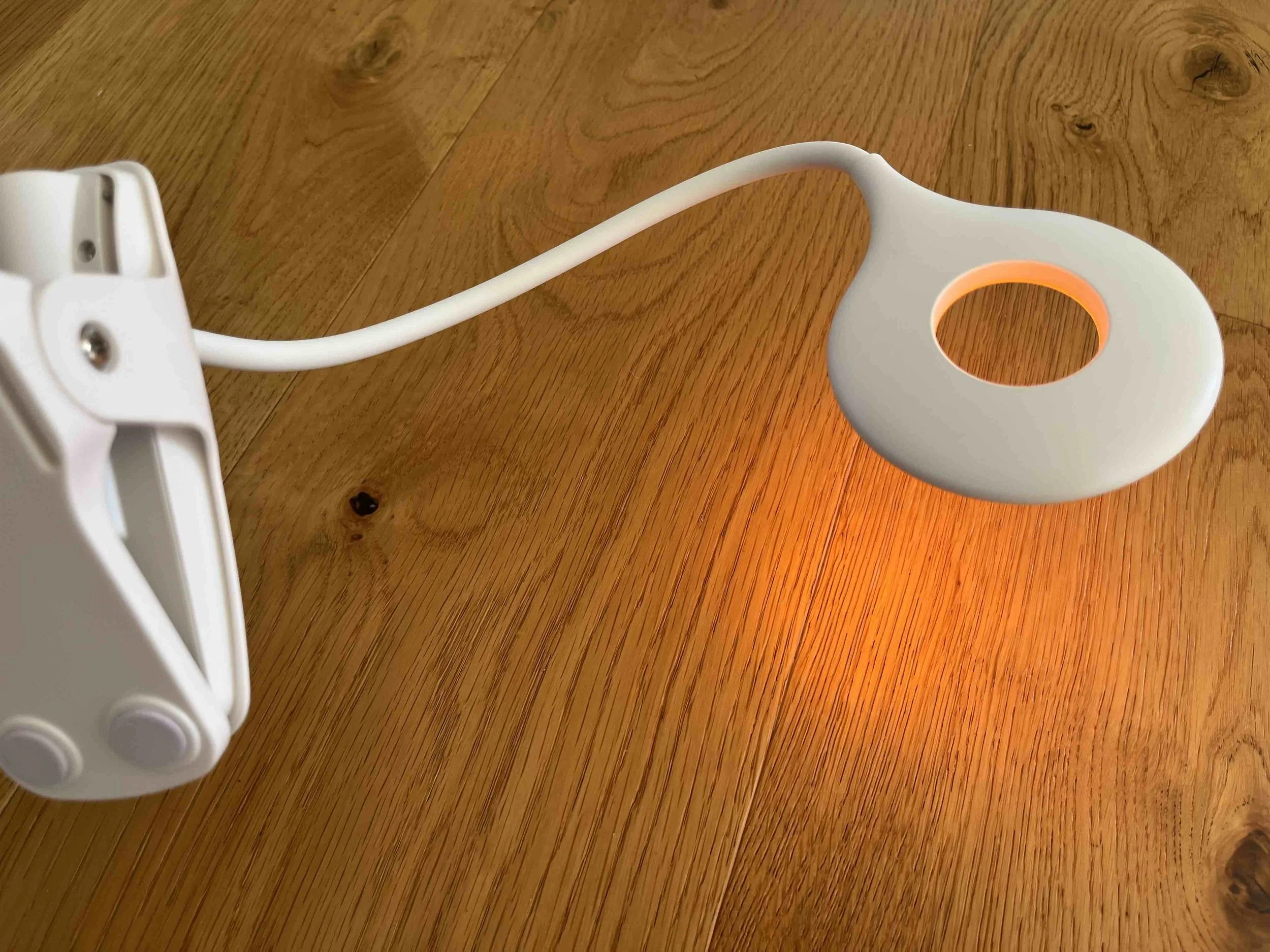 Blue light free amber clip-on lamp for nighttime reading and screen-free sleep support
