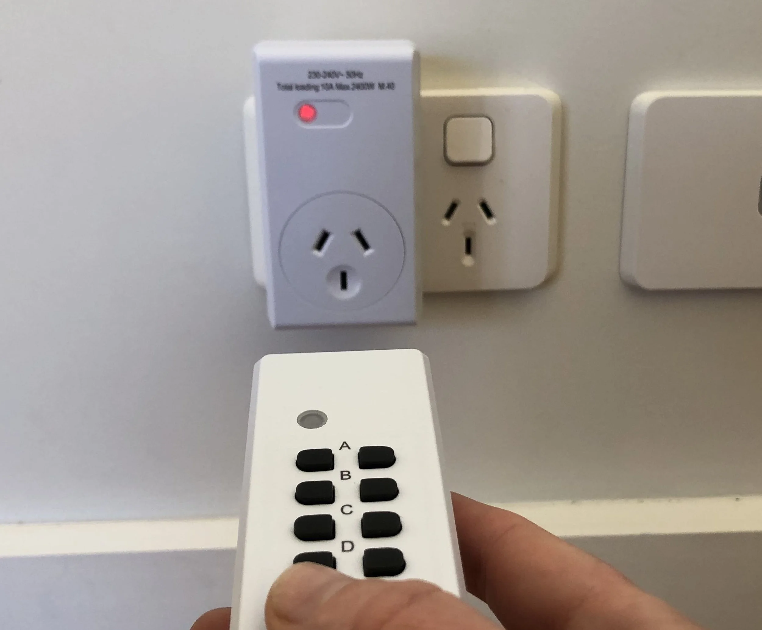 Remote controlled plug adaptor used to switch off a Wi-Fi router and bedroom electronics.