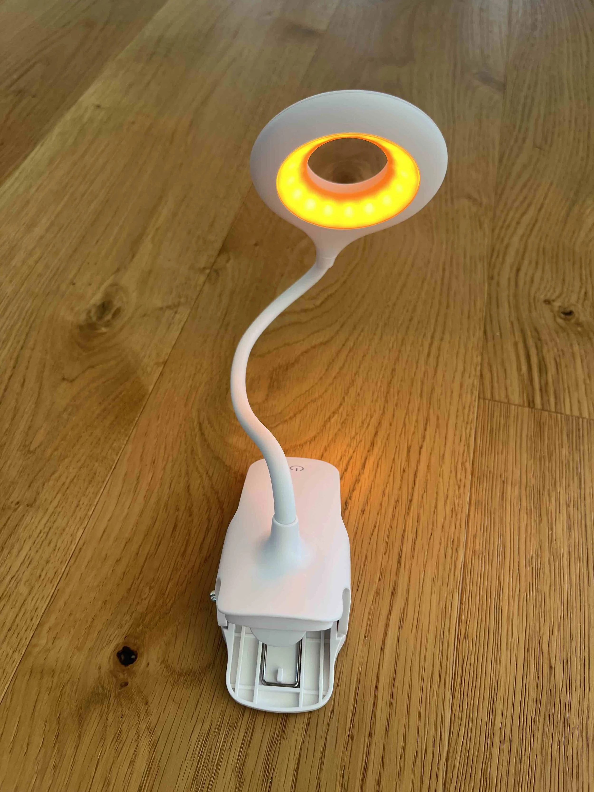 Amber clip-on LED lamp with blue light blocking and no EMF for sleep-friendly lighting