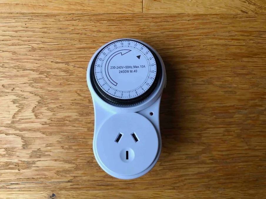 24-hour mechanical timed plug with rotating dial for New Zealand power outlets