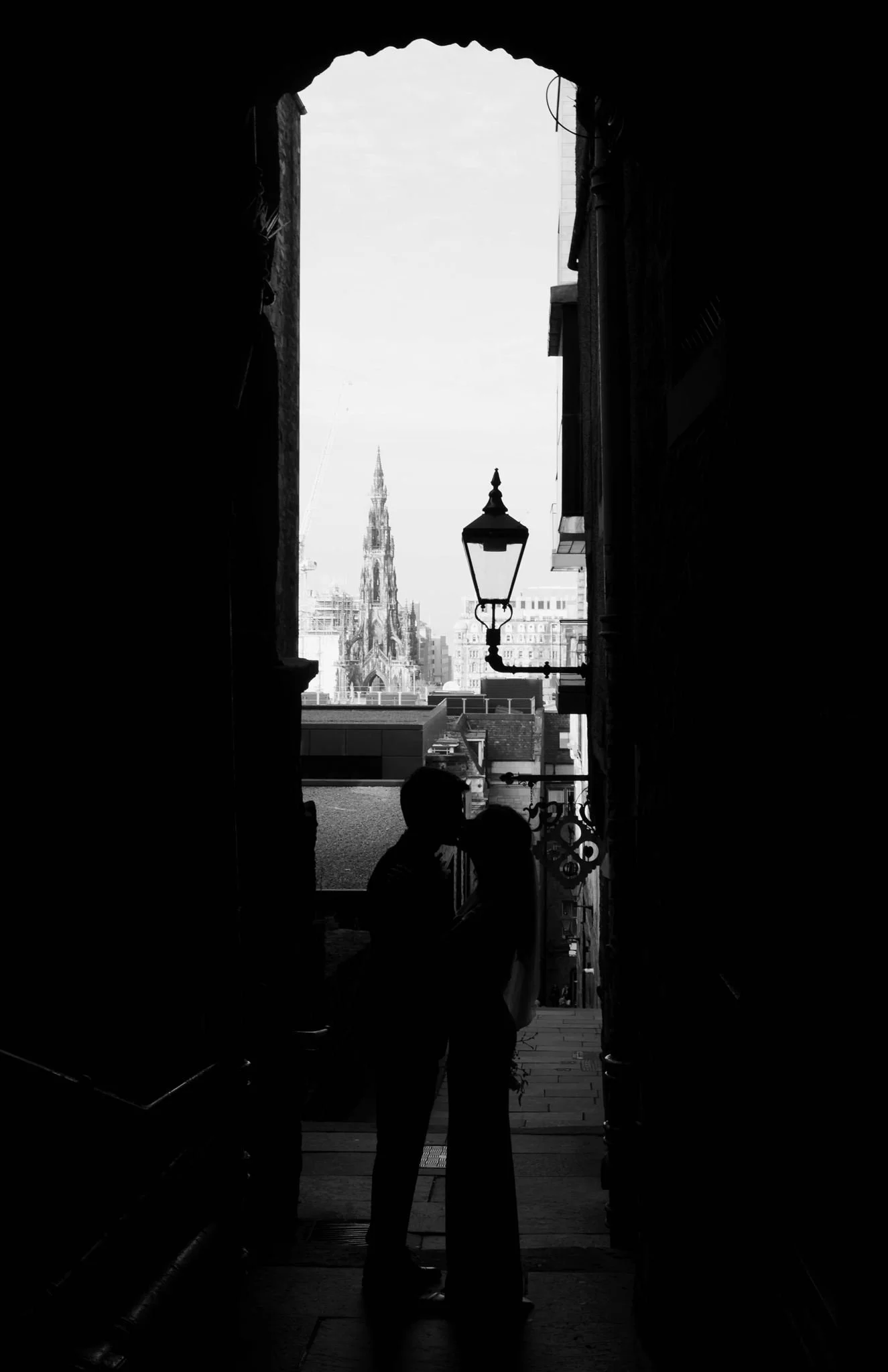 Wedding couple celebrating outside Edinburgh City Chambers, captured by an Edinburgh City Chambers wedding photographer in a street style.