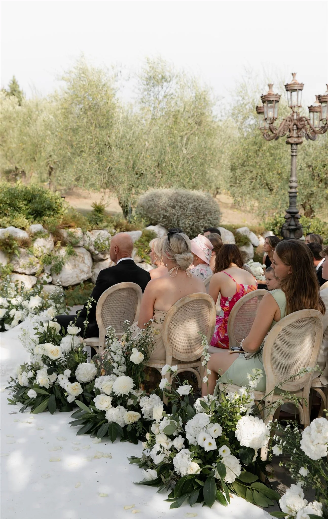 An outdoor wedding ceremony at Tenuta Corbinaia Villa in Tuscany, Italy.