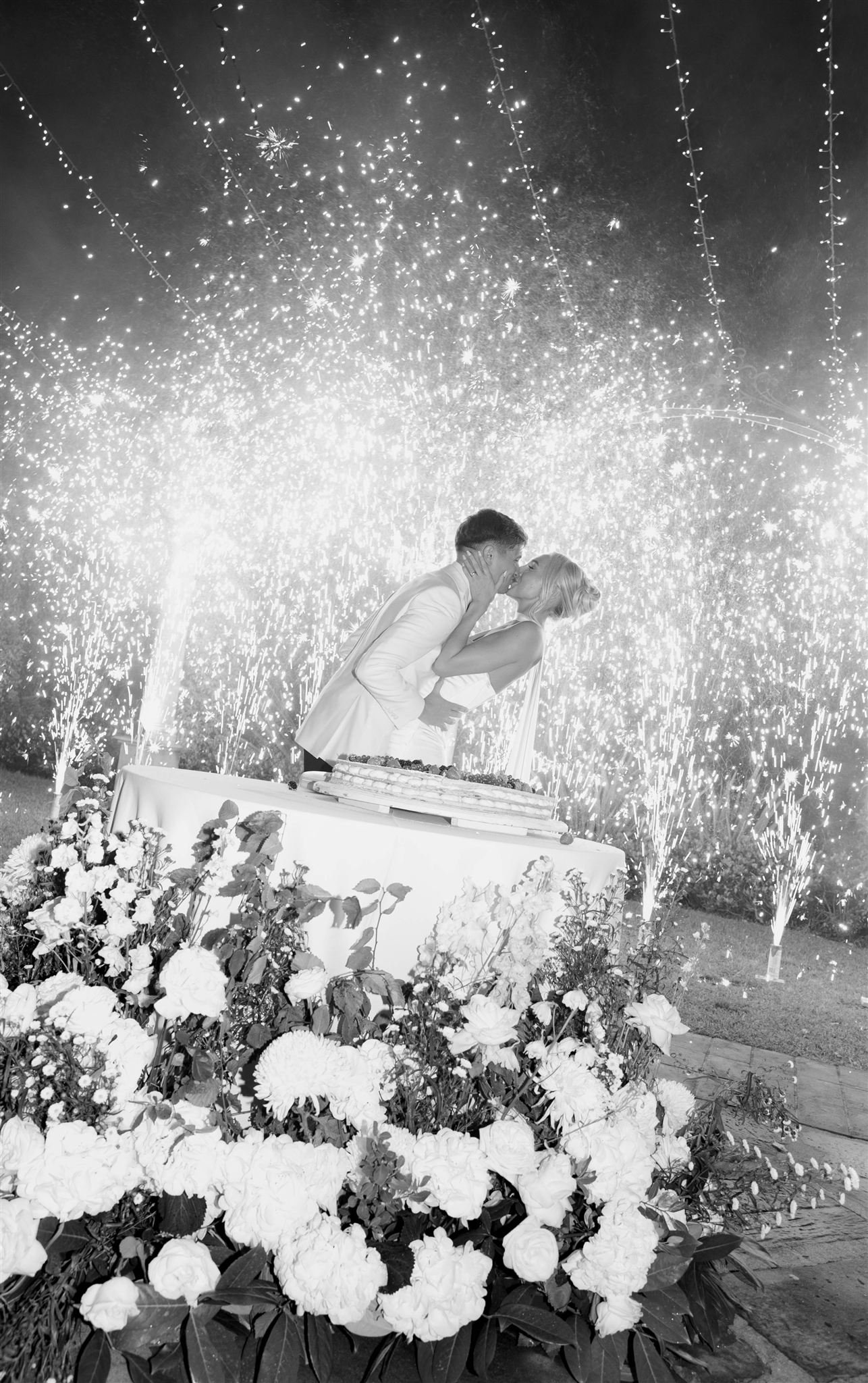 An italian cake cutting on a wedding day at Tenuta Corbinaia Villa in Tuscany, Italy.