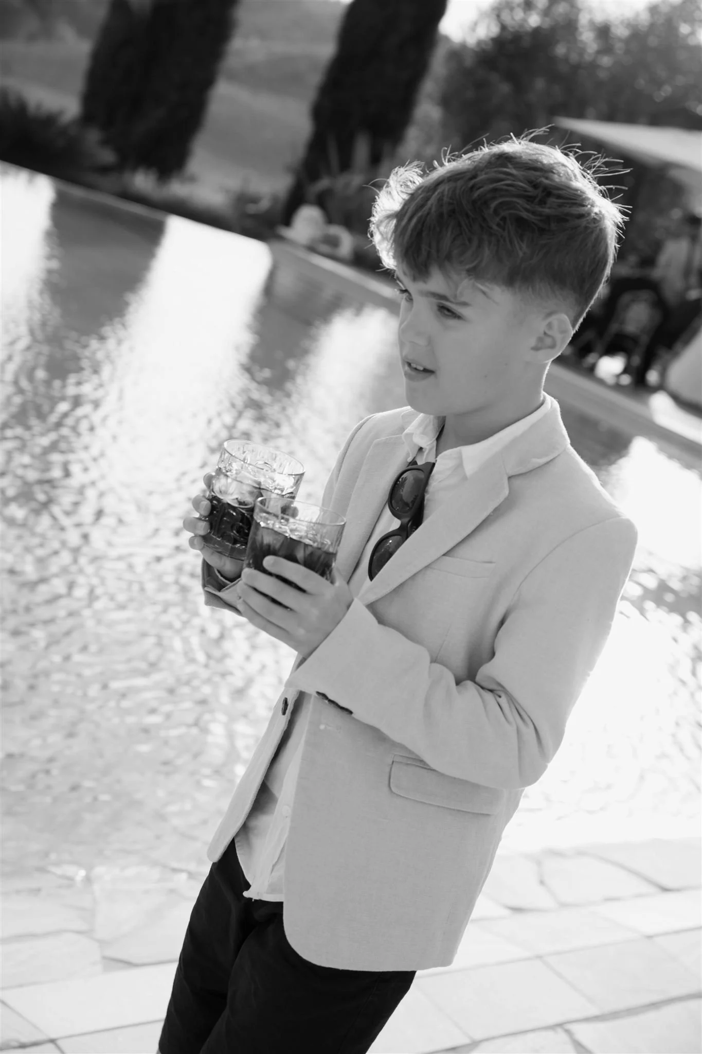 A poolside cocktail hour on a wedding day at Tenuta Corbinaia Villa in Tuscany, Italy.