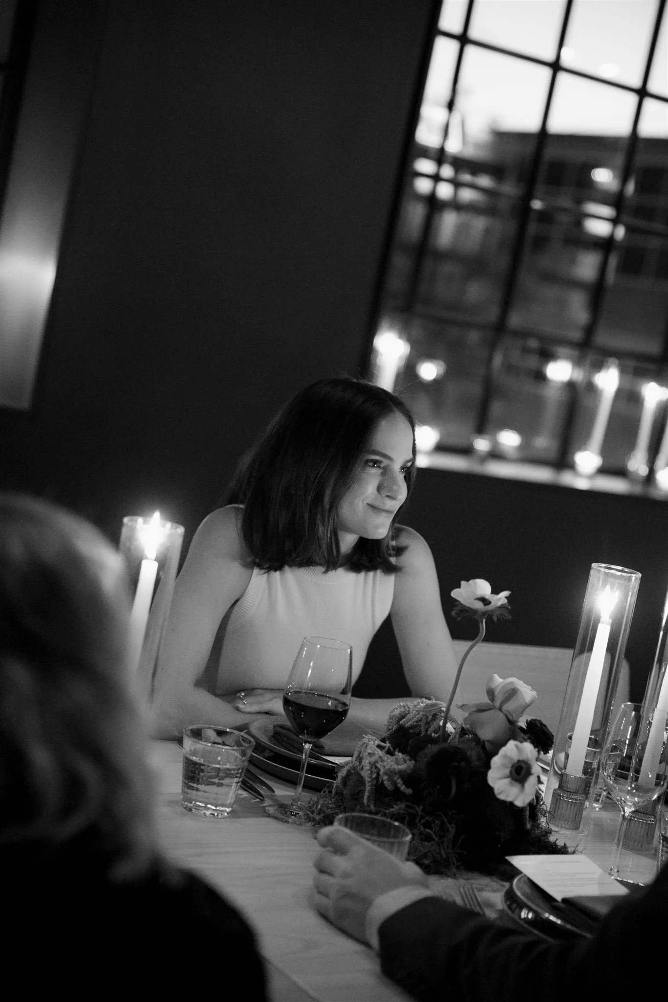 Bride at a candlelit rehearsal dinner at Maxwells Trading Chicago wedding venue.