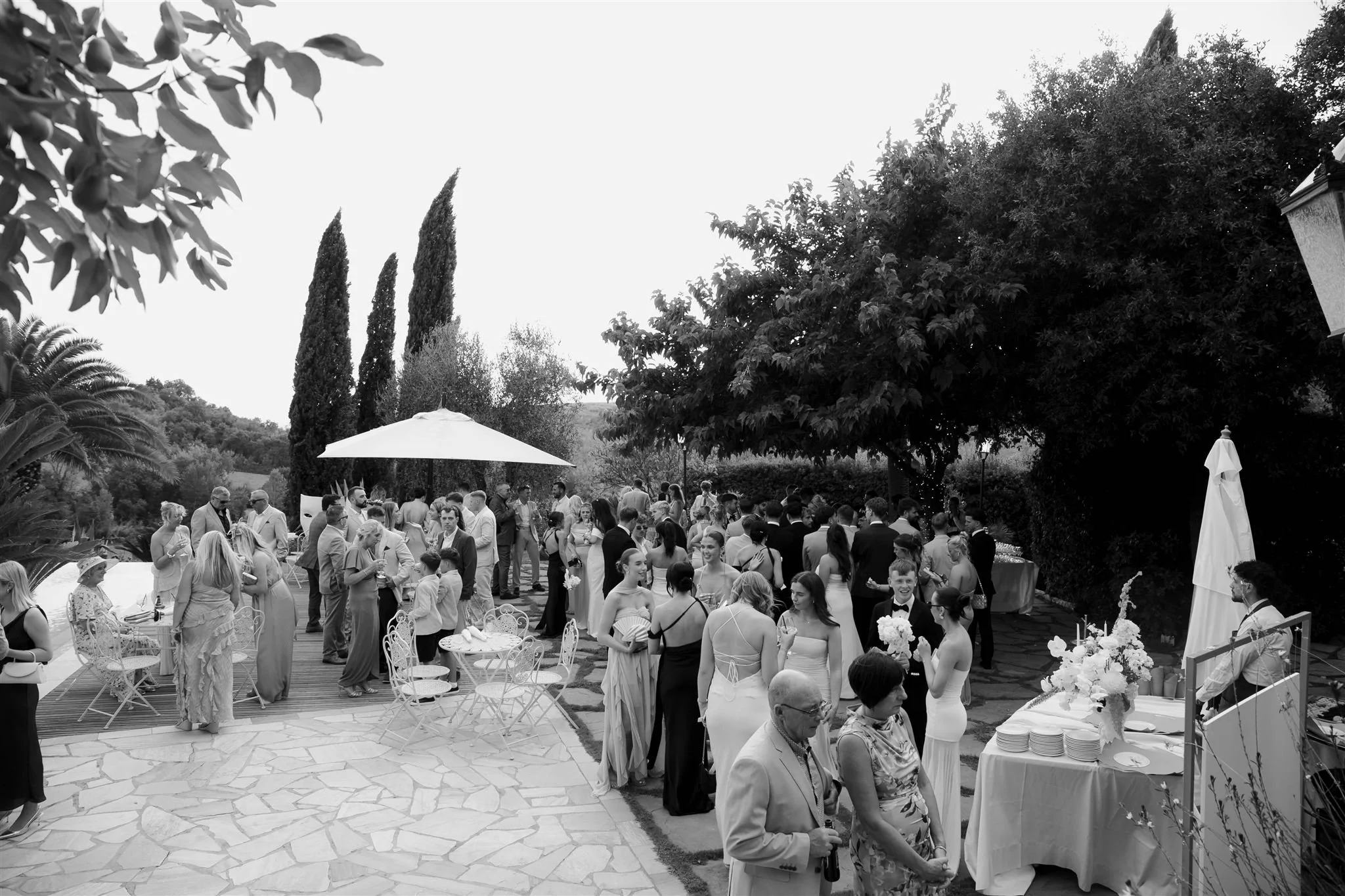 A poolside cocktail hour on a wedding day at Tenuta Corbinaia Villa in Tuscany, Italy.
