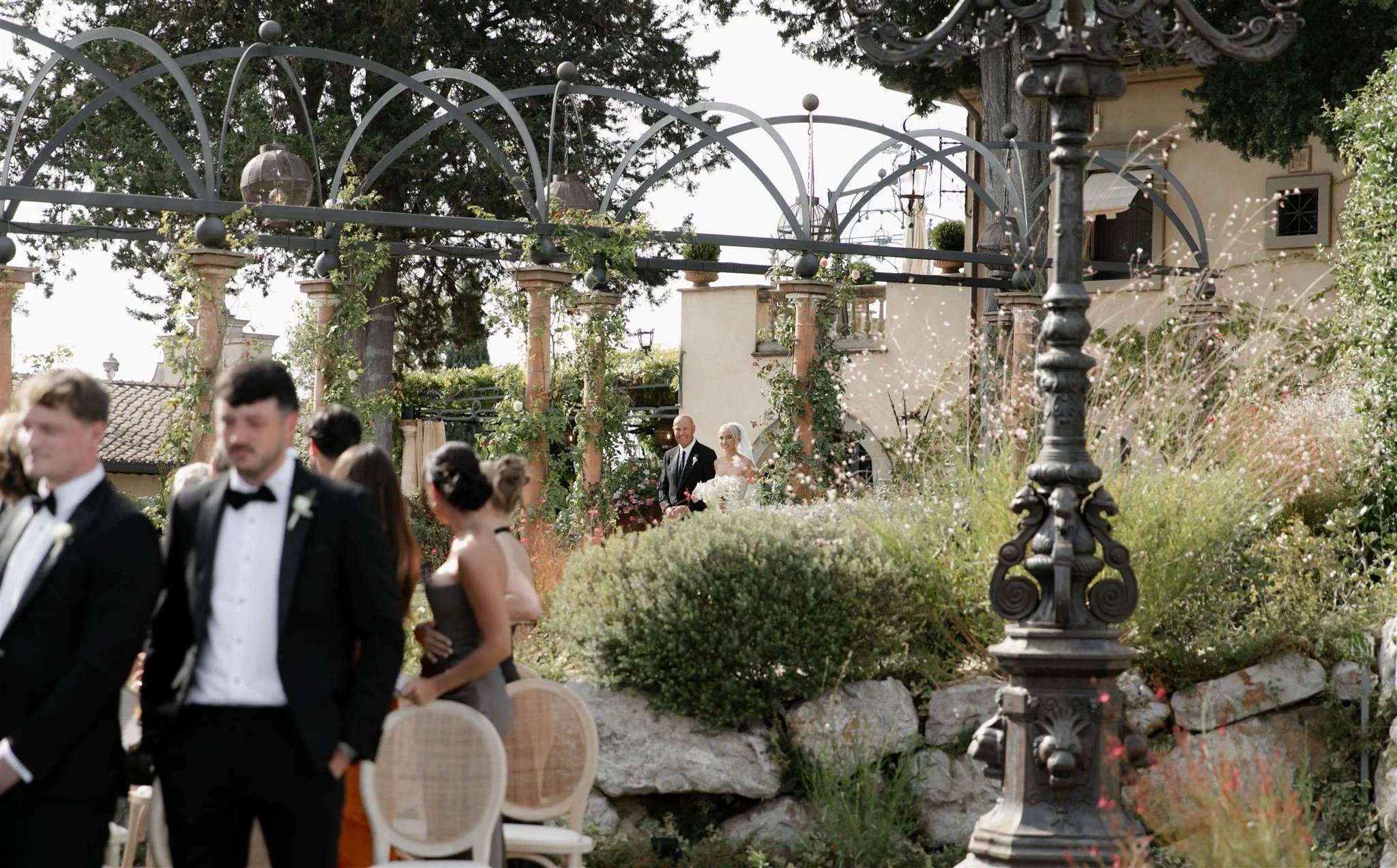 Father walking bride down the aisle on a wedding day at Tenuta Corbinaia Villa in Tuscany, Italy.