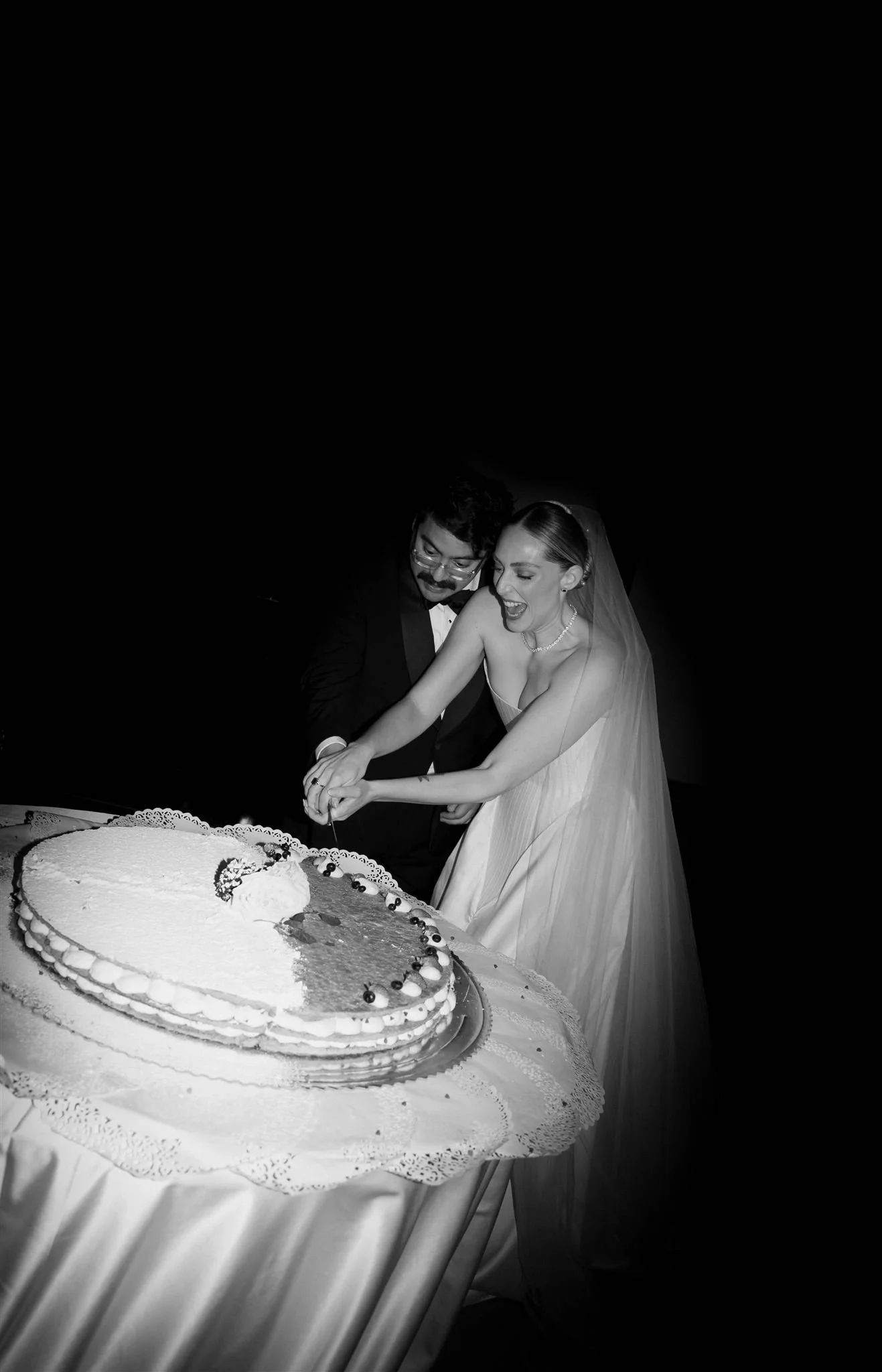 Cake Cutting on a wedding day at Villa Medicea Di Lilliano in Tuscany, Italy.