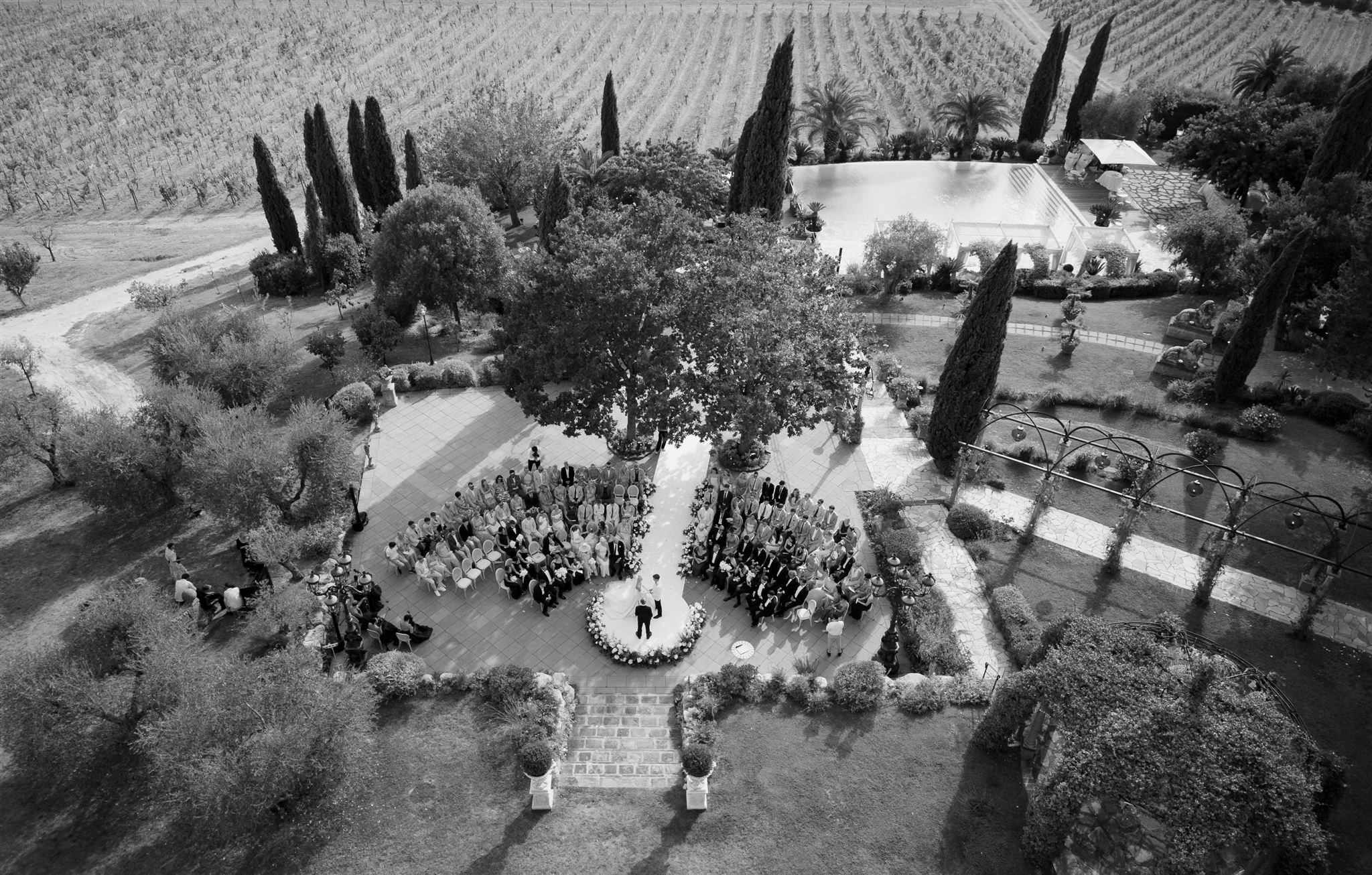 An outdoor wedding ceremony at Tenuta Corbinaia Villa in Tuscany, Italy.