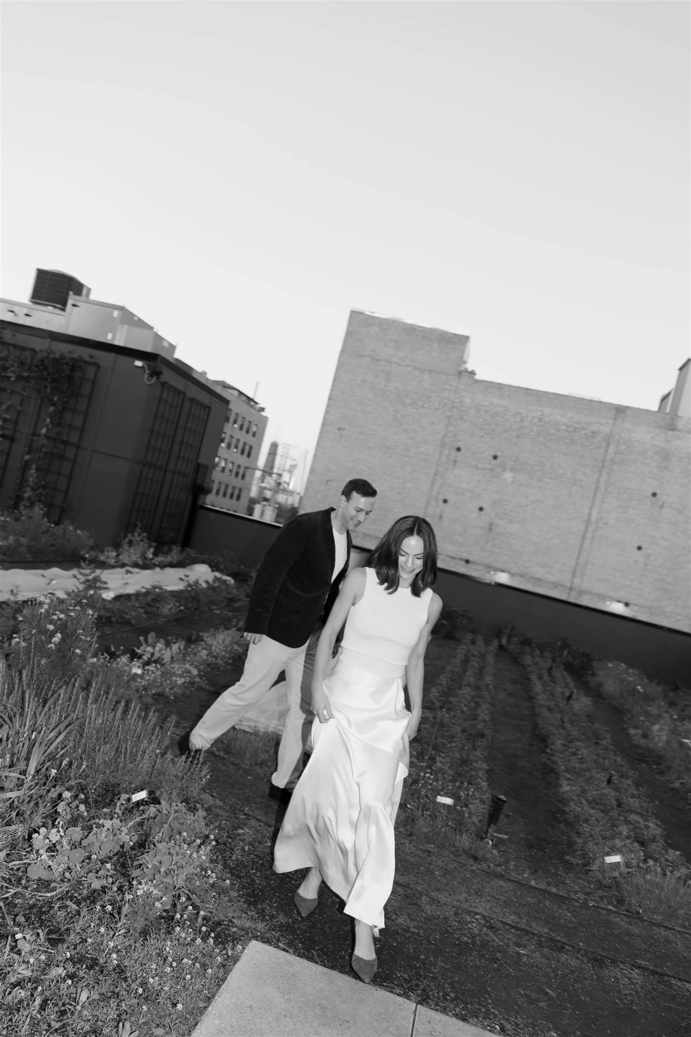 Maxwells Trading Chicago wedding rehearsal dinner with rooftop skyline portraits in downtown Chicago.