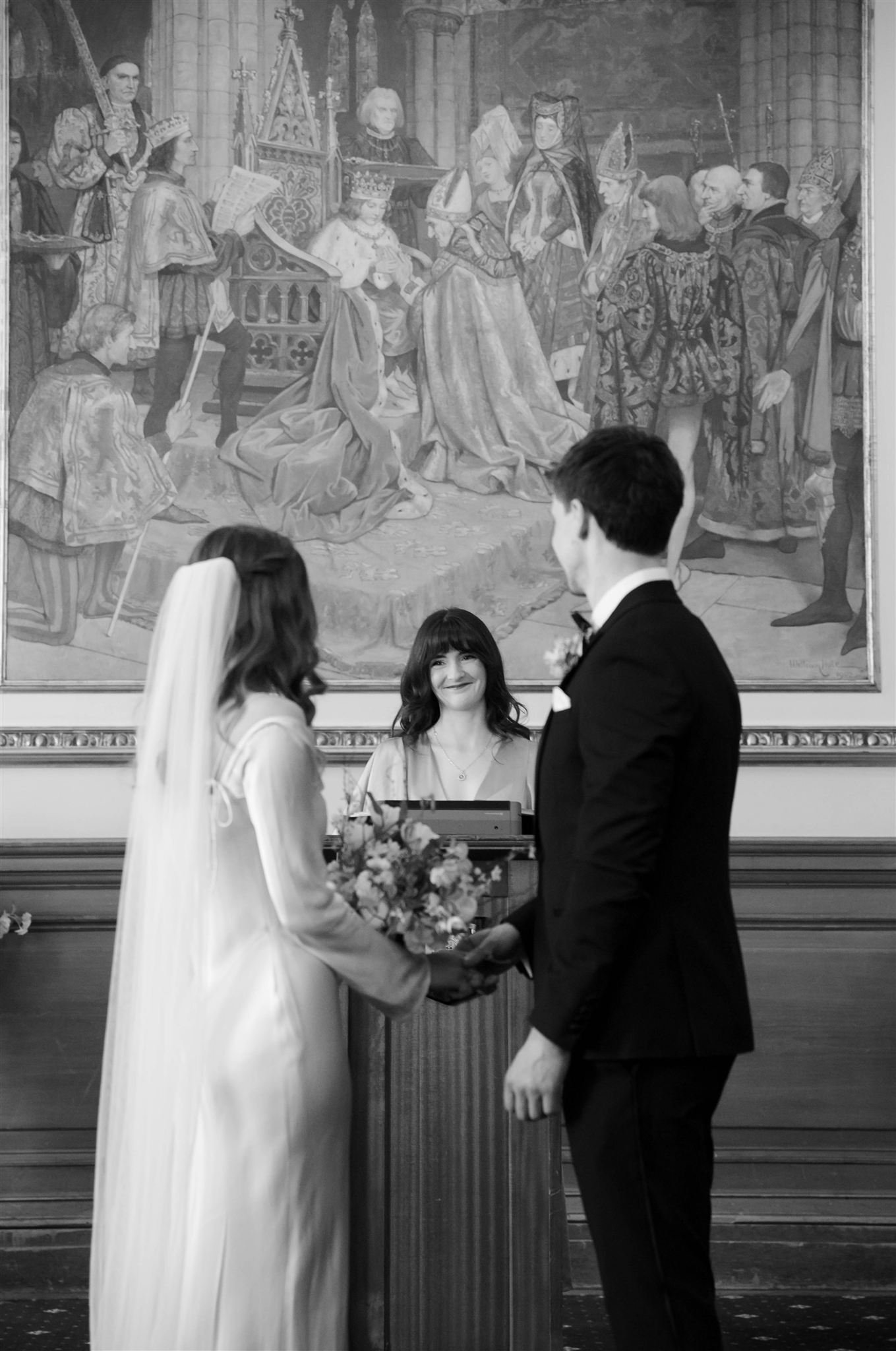 Bridesmaid inside Edinburgh City Chambers on their wedding day in Edinburgh.