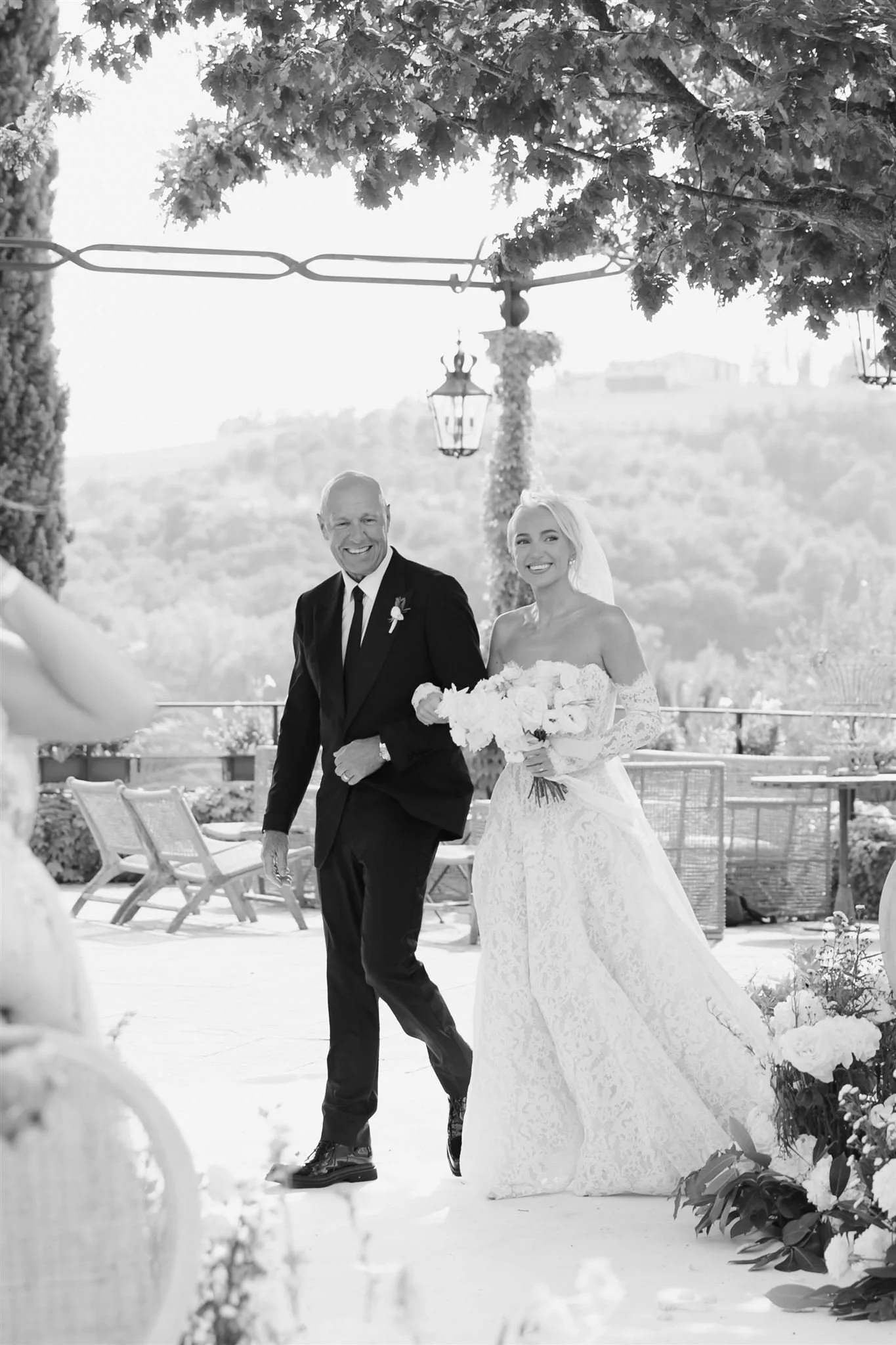 Father walking bride down the aisle on a wedding day at Tenuta Corbinaia Villa in Tuscany, Italy.