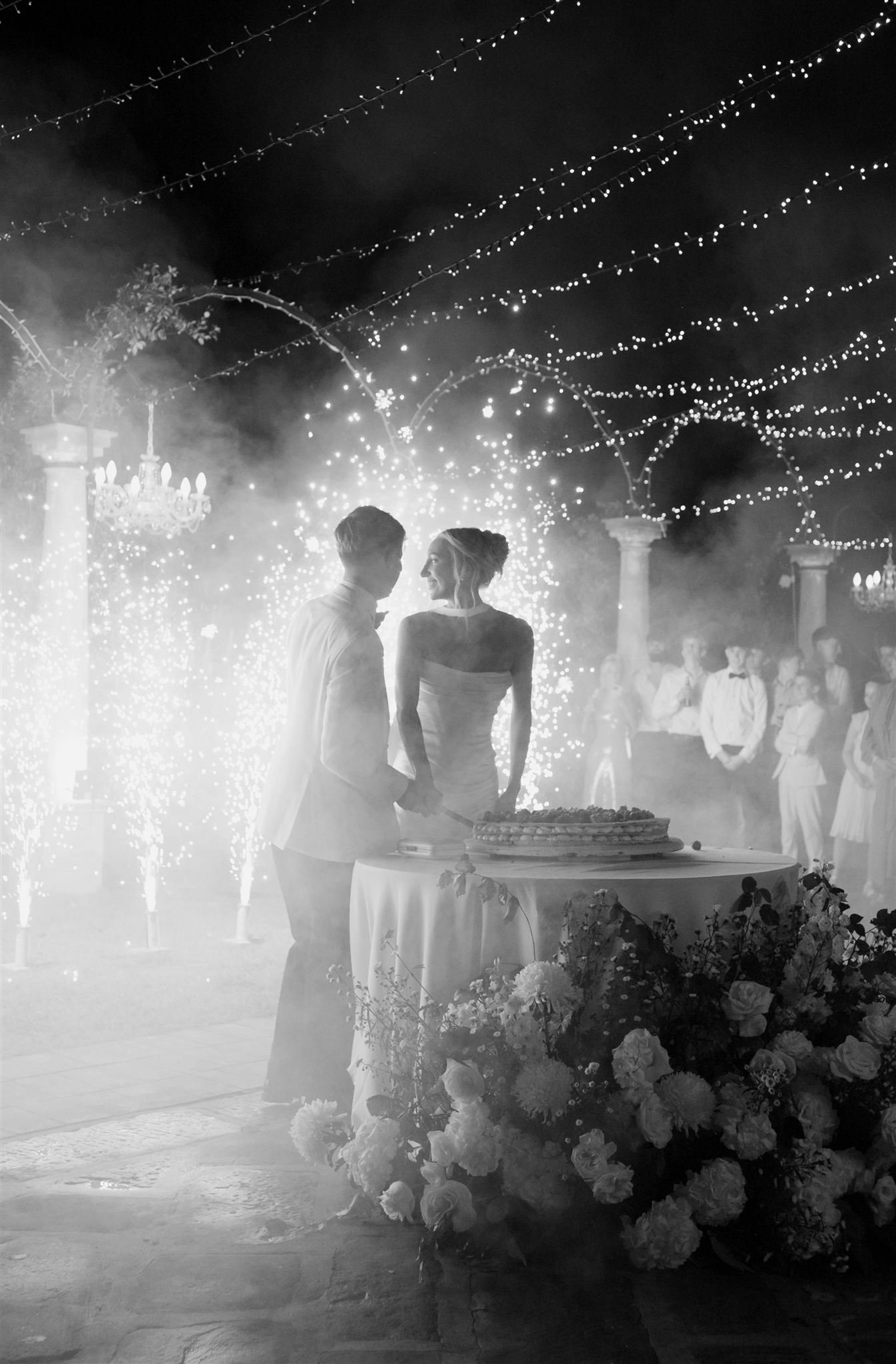 An italian cake cutting on a wedding day at Tenuta Corbinaia Villa in Tuscany, Italy.