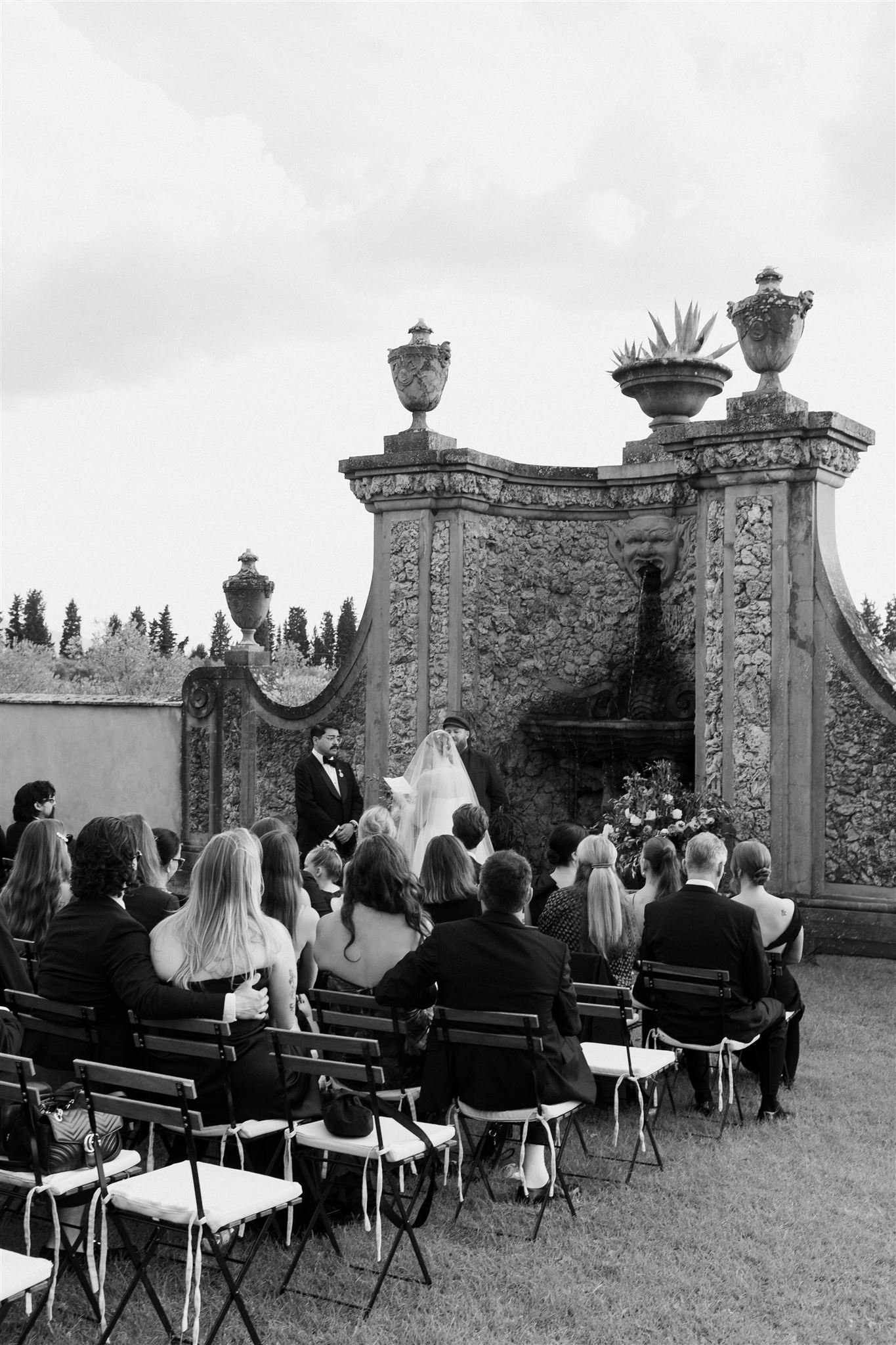 Garden Wedding Ceremony on a wedding day at Villa Medicea Di Lilliano in Tuscany, Italy.