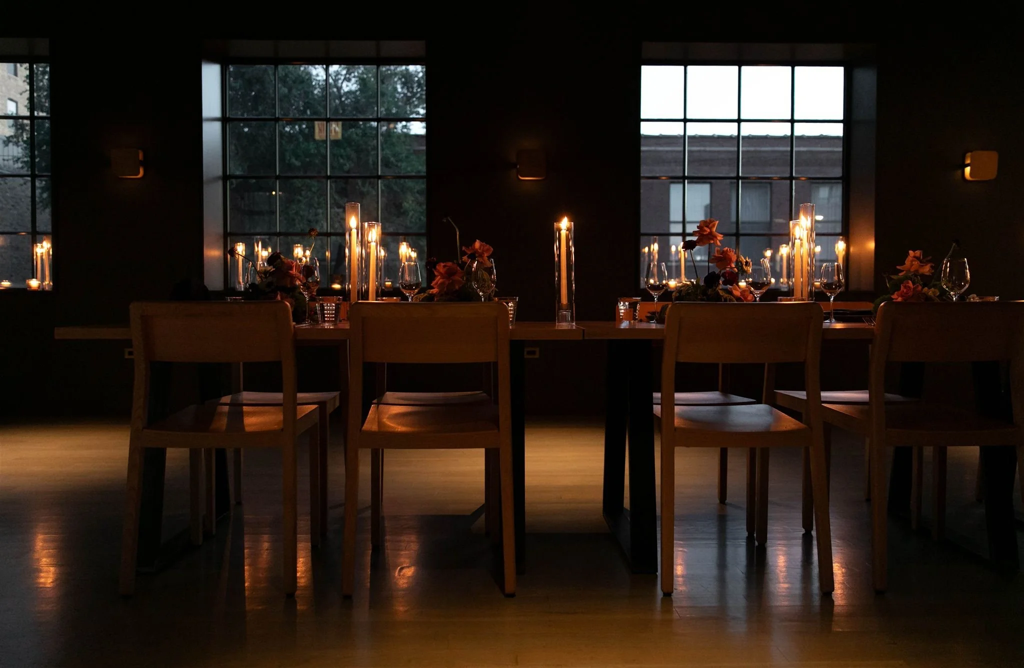 Intimate candlelit rehearsal dinner at Maxwells Trading Chicago wedding venue.