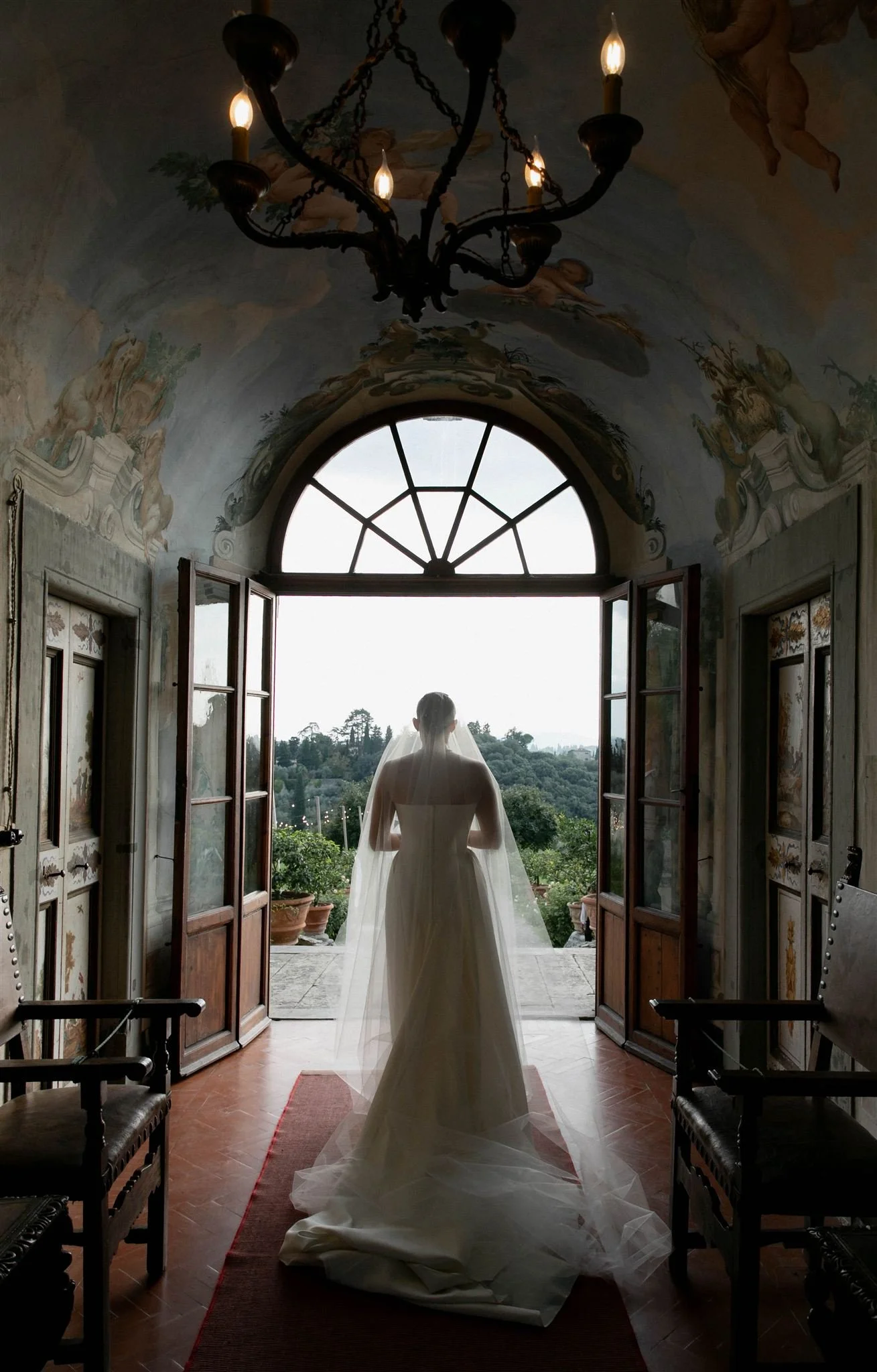 Bride with a veil on a wedding day at Villa Medicea Di Lilliano in Tuscany, Italy.