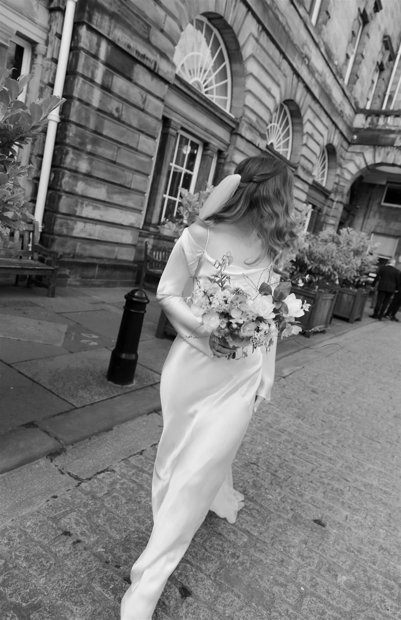 Bride celebrating her wedding day in Edinburgh city centre.