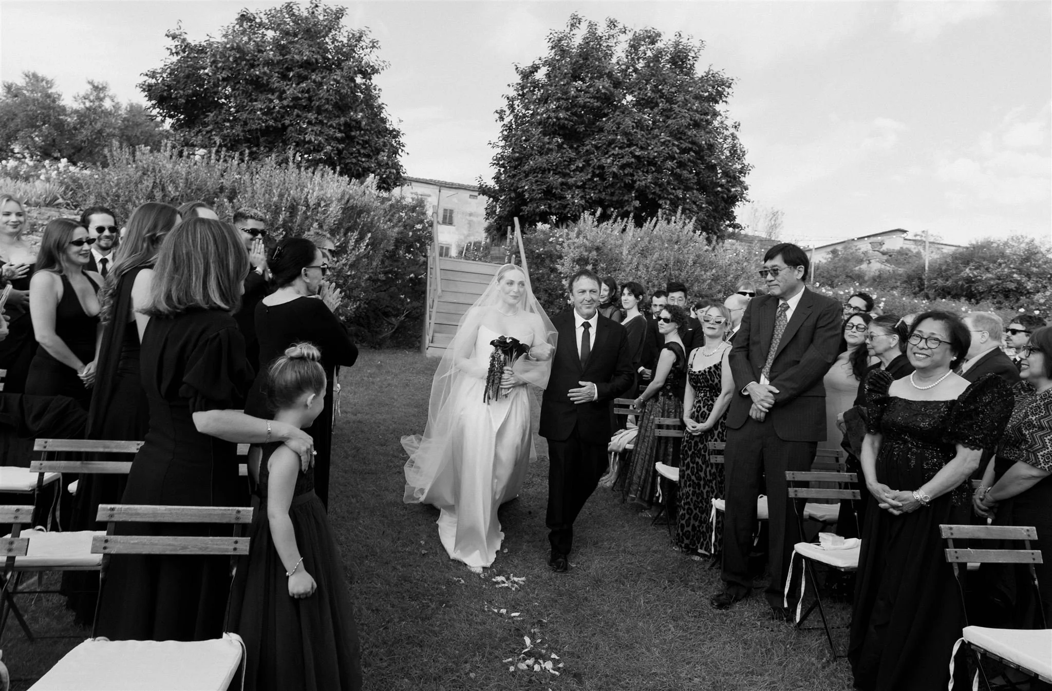 Garden Wedding Ceremony on a wedding day at Villa Medicea Di Lilliano in Tuscany, Italy.