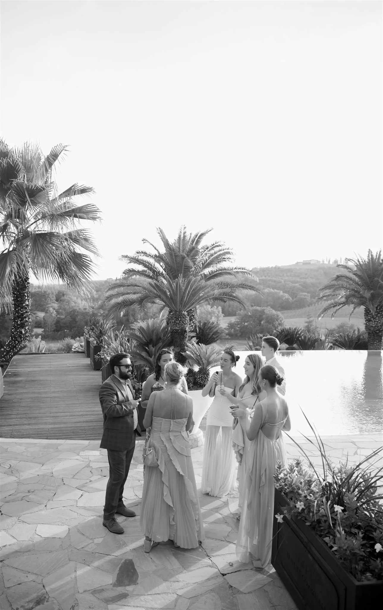 A poolside cocktail hour on a wedding day at Tenuta Corbinaia Villa in Tuscany, Italy.