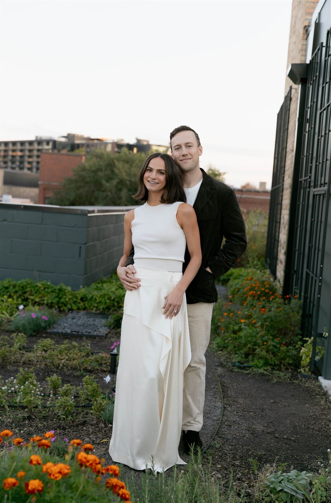 Maxwells Trading Chicago wedding rehearsal dinner with rooftop skyline portraits in downtown Chicago.