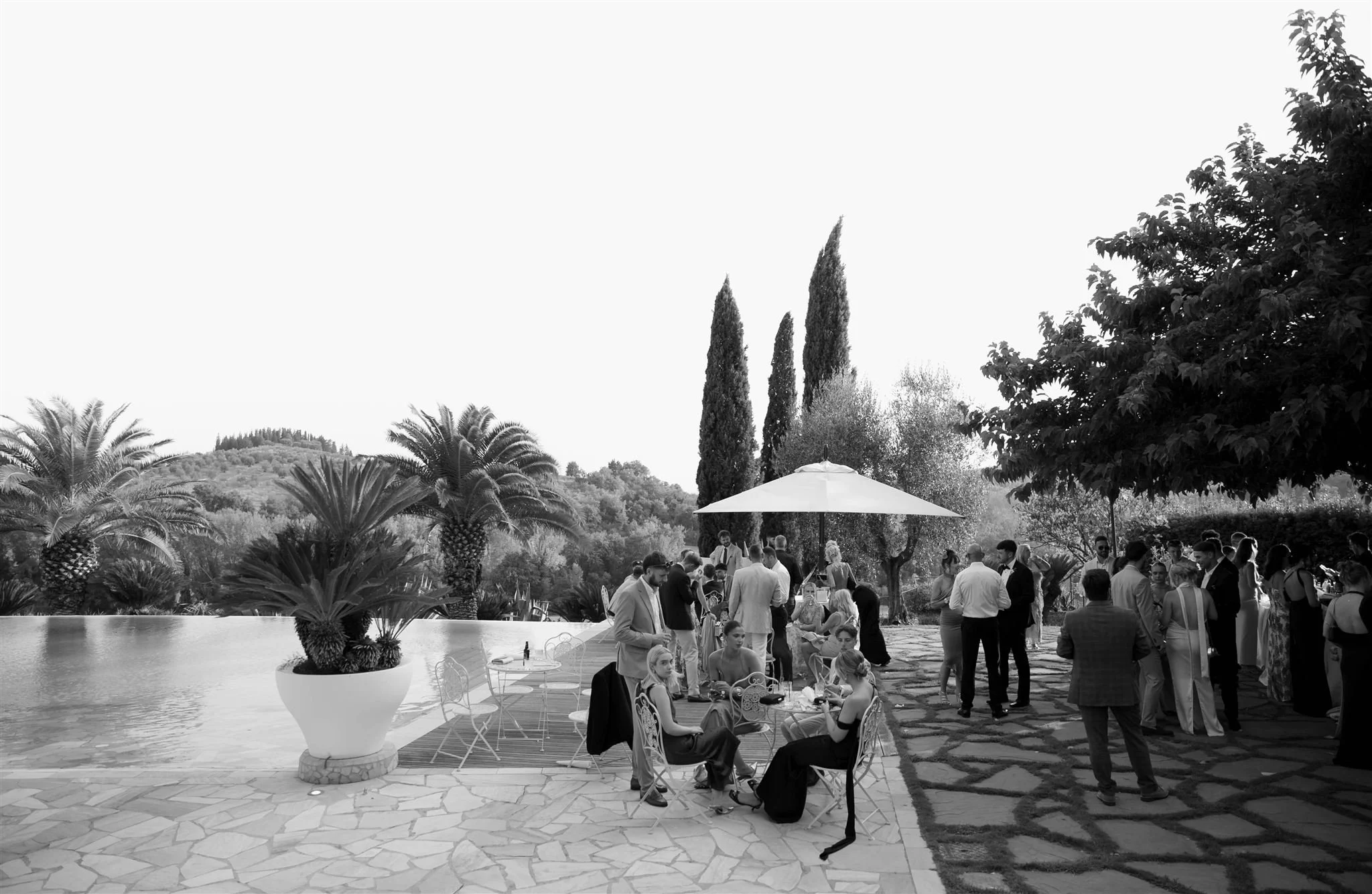 A poolside cocktail hour on a wedding day at Tenuta Corbinaia Villa in Tuscany, Italy.