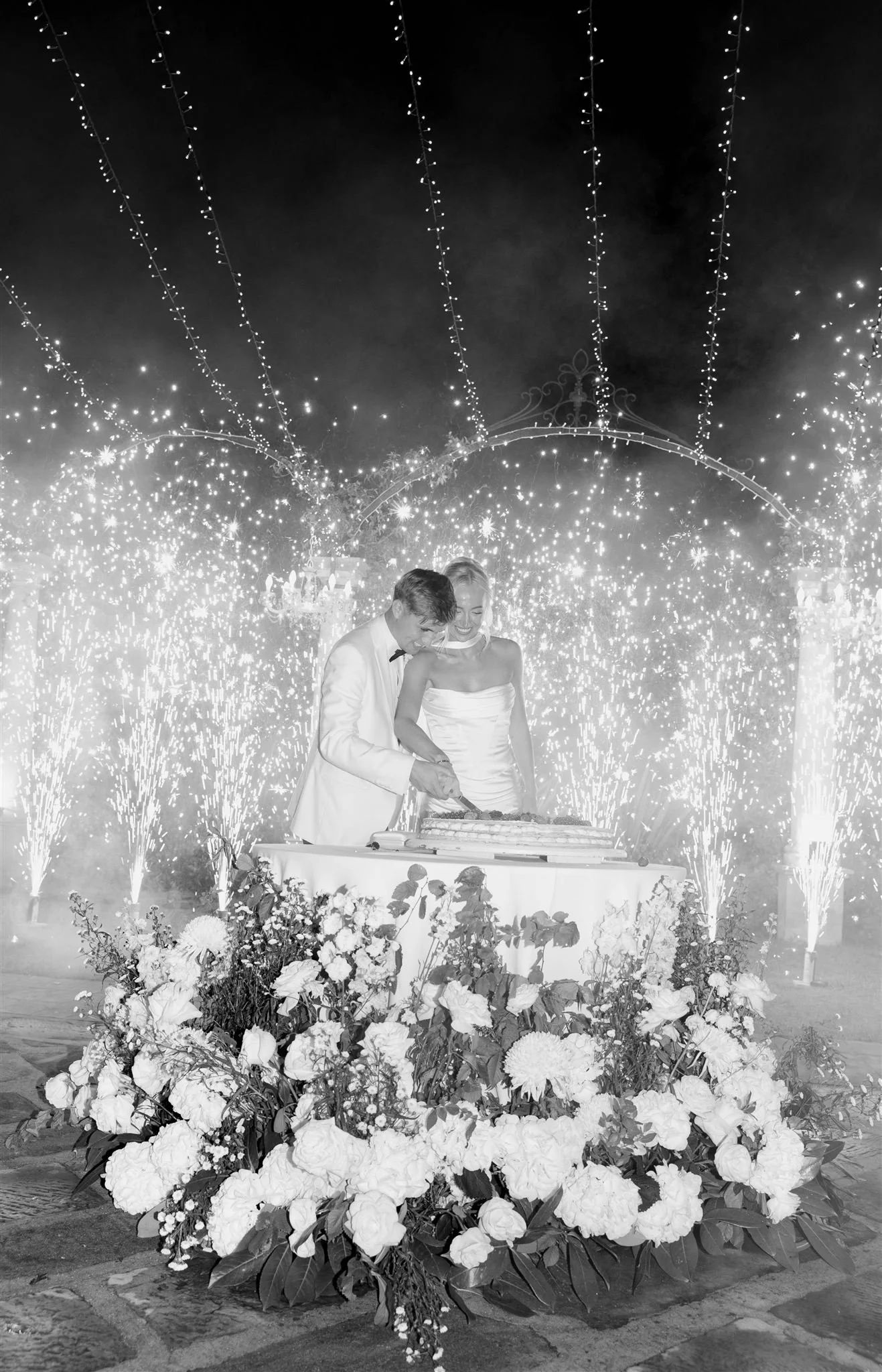 An italian cake cutting on a wedding day at Tenuta Corbinaia Villa in Tuscany, Italy.