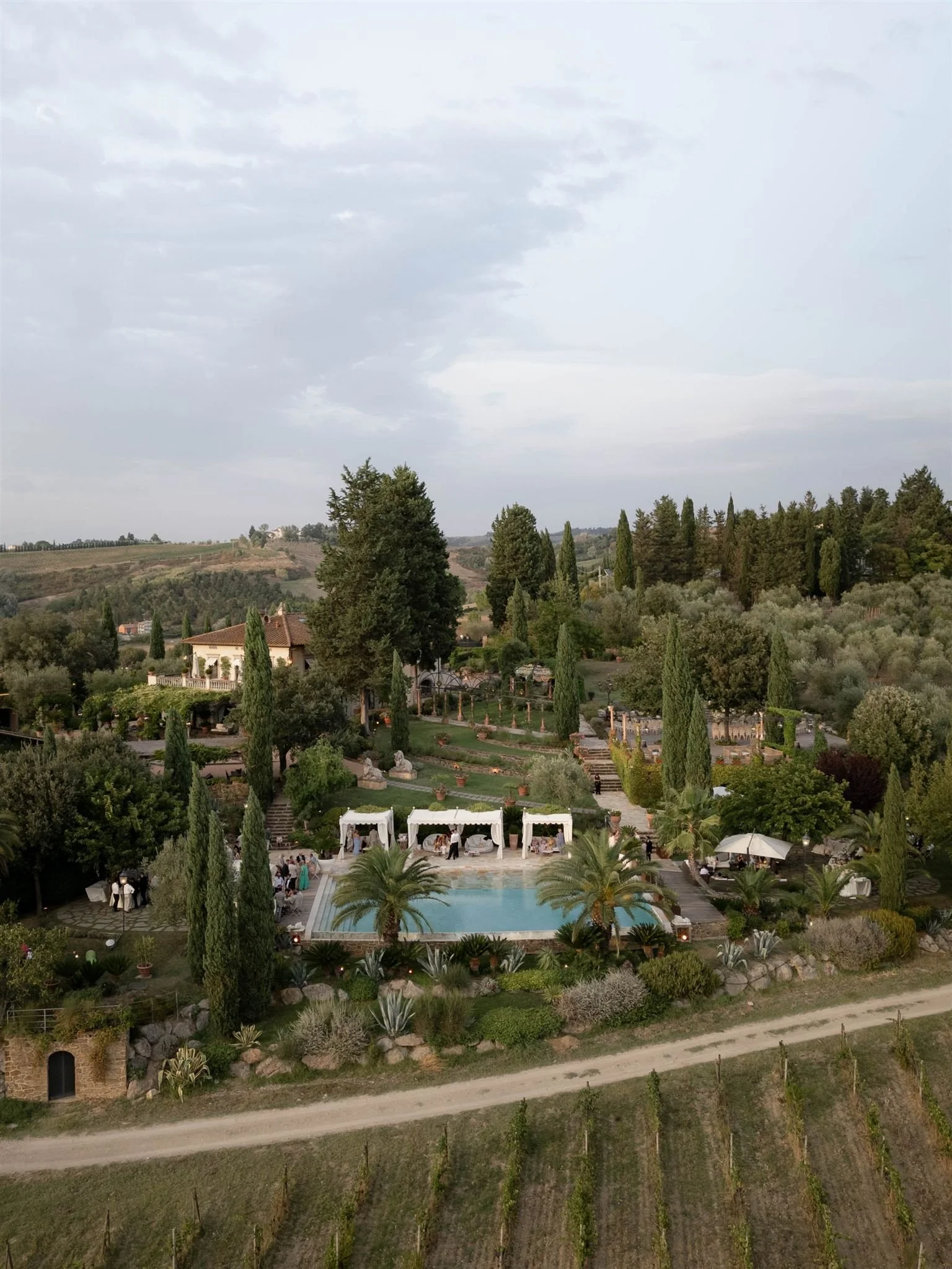 A poolside cocktail hour on a wedding day at Tenuta Corbinaia Villa in Tuscany, Italy.