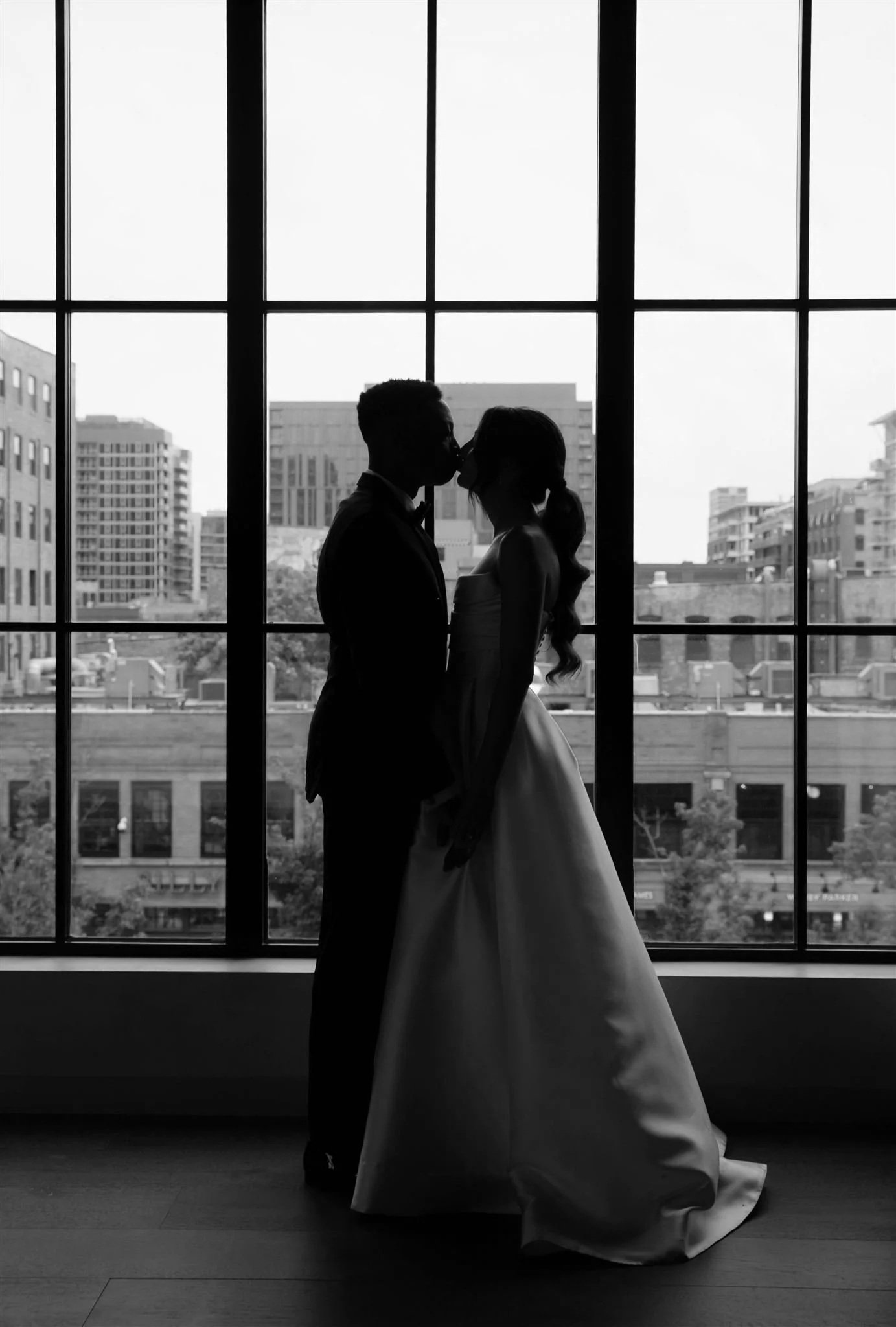 Couple Portraits at Nobu Hotel on a wedding day in Chicago in front of skyline.