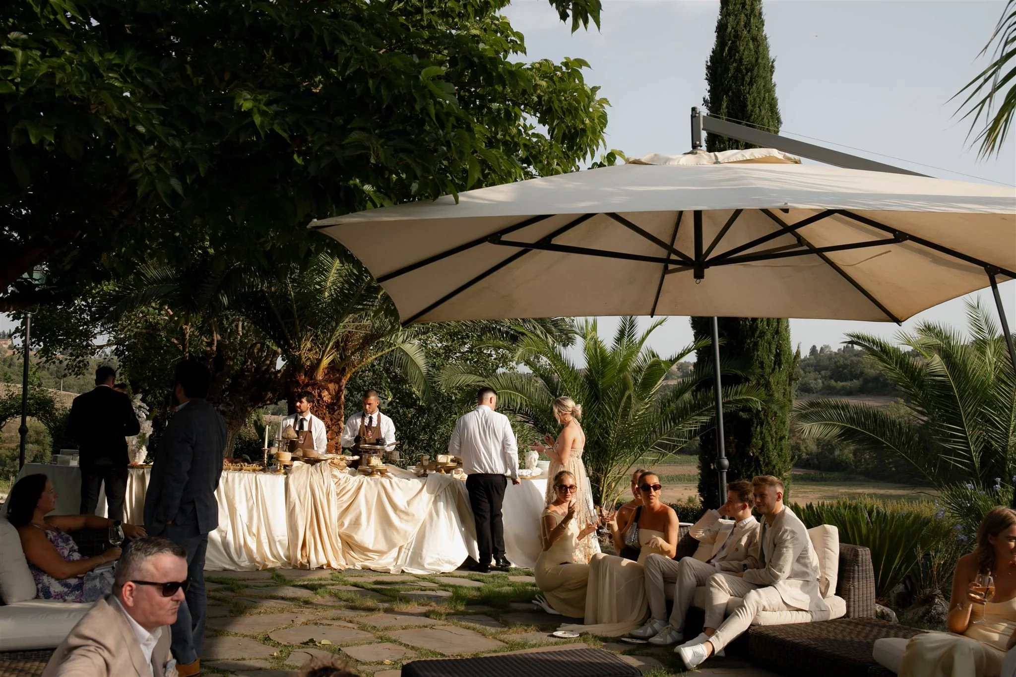 A poolside cocktail hour on a wedding day at Tenuta Corbinaia Villa in Tuscany, Italy.